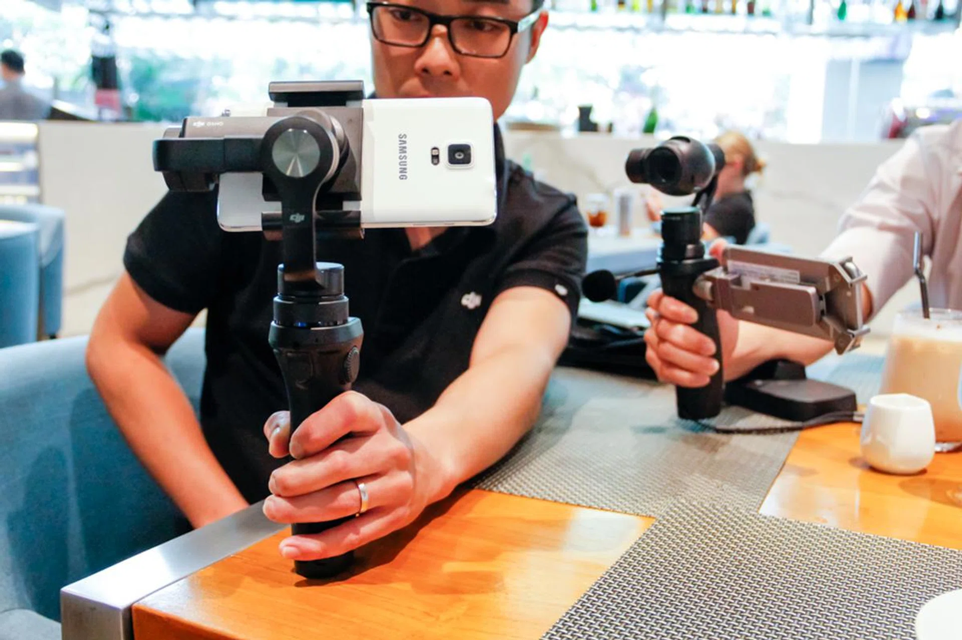 The Osmo Mobile (front) with the original Osmo (back).