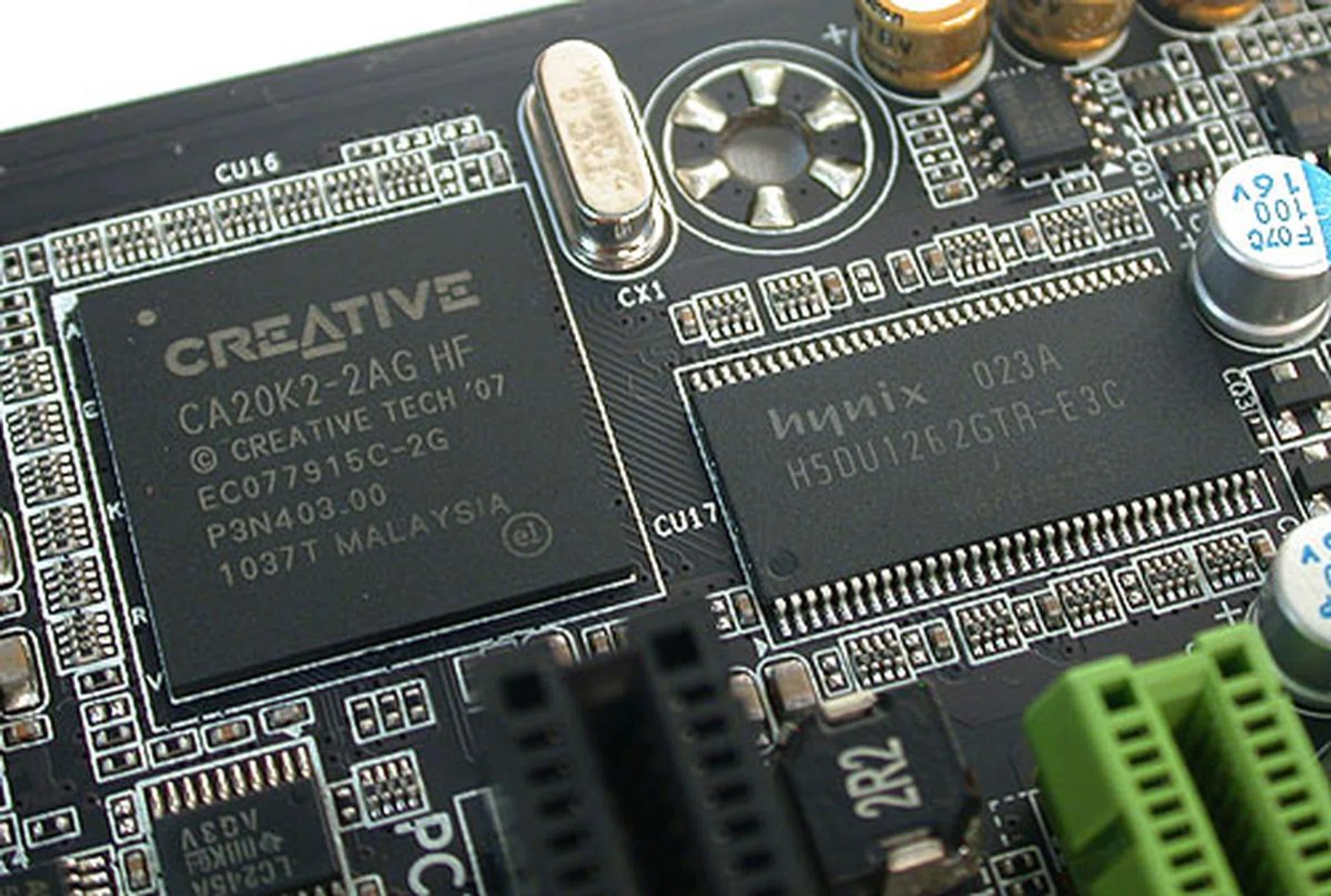 The Creative X-Fi chip, along with its own dedicated memory module. So you'll get the complete Creative suite of supported technologies, from EAX 5.0 to the X-Fi Crystalizer. As part of its gamer-oriented features, the board also has high capacity amplifiers able to drive 150Ω loads, which together with the proper high-quality headphones, will lead to less distortion and crisper audio.