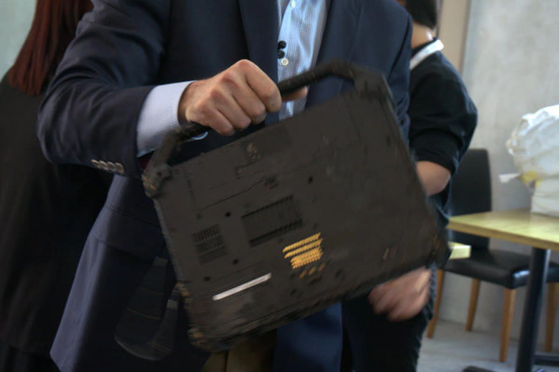 The Dell Latitude Rugged Extreme was held by its handle to shake off remaining water from the demo.