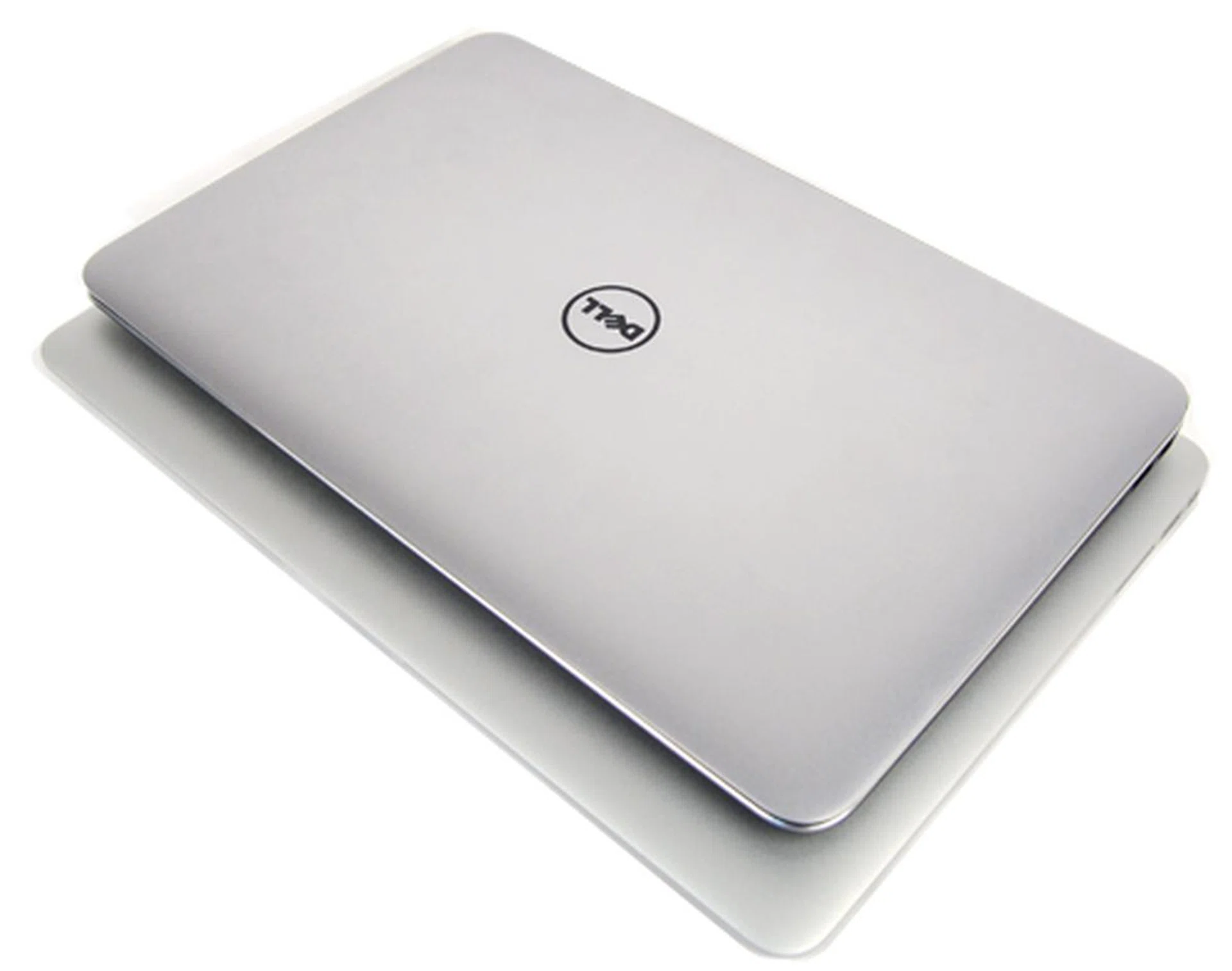 The Dell XPS 13 sitting on a 13-inch MacBook Air. It's more compact...