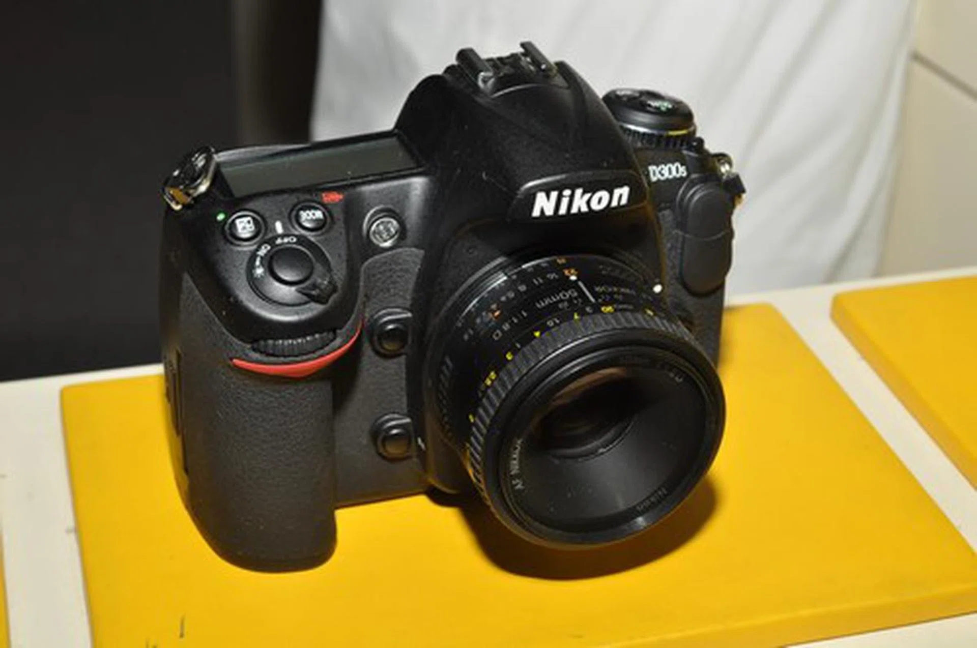 The D300s, the highest-end DX DSLR camera in Nikon's stable, is selling for $2388 (body only) at the show, but you get a free 50mm f/1.8 lens and other freebies including a Black Rapid strap and Kata bag.