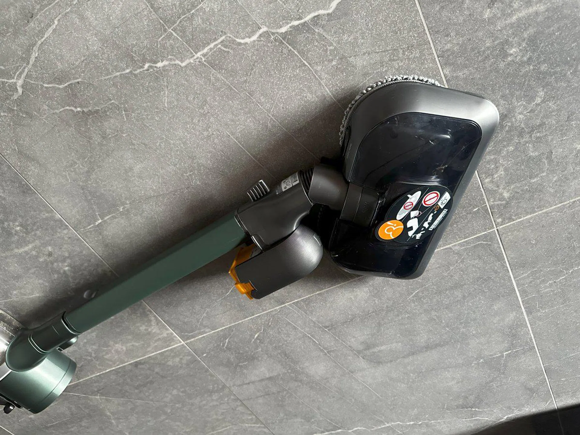 Fortunately, unlike the wide brush head, the mop head allows the vacuum to be swiveled flat on the side to reach under furniture.