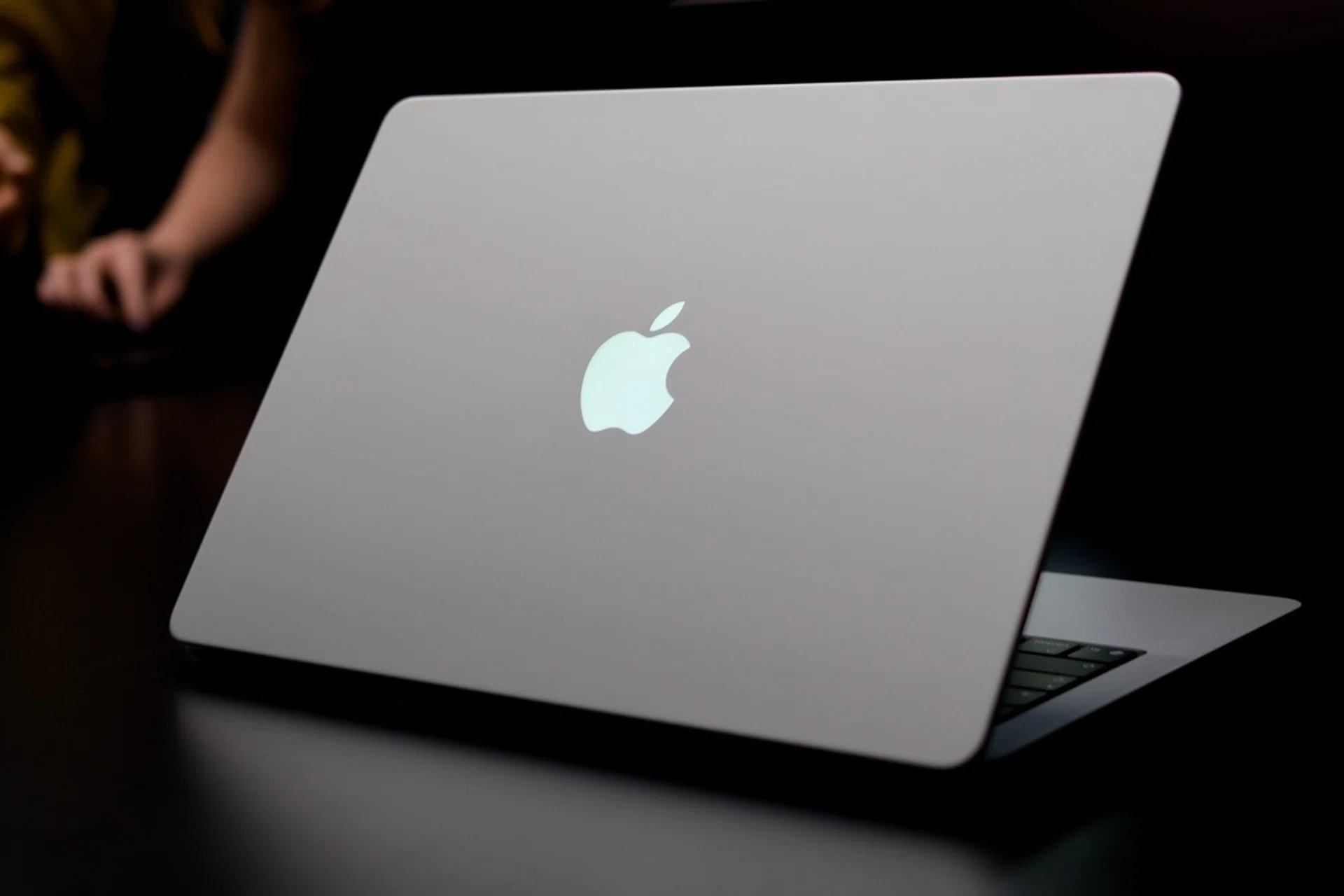 Apple MacBook Pro with PROLED XDR Display glowing logo