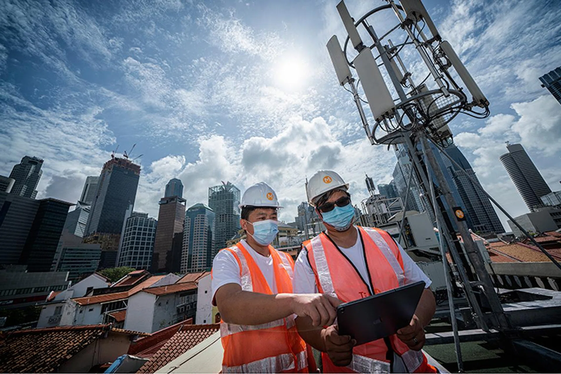 M1's engineers toiling behind the scenes to bring up its 5G networks. Image credit: M1.