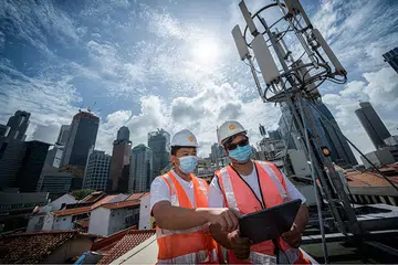 M1's engineers toiling behind the scenes to bring up its 5G networks. Image credit: M1.