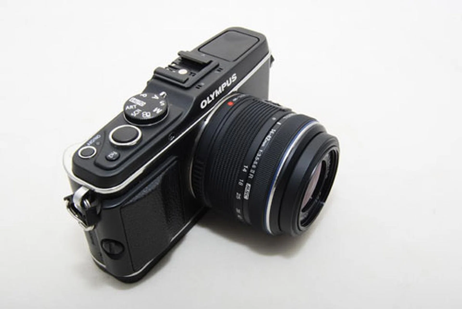 The Olympus E-P3 with a standard 14-42mm kit lens mounted (lens is retracted). It's very similar in size to when the 45mm is attached.