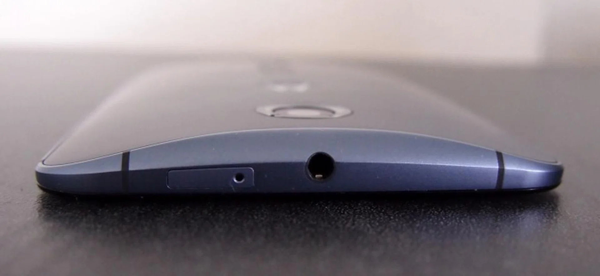 As you can see, the rear of the Motorola Nexus 6 is curved and you can cradle the device comfortably in your hand. You will also notice the nano-SIM card slot and 3.5mm audio output jack here.