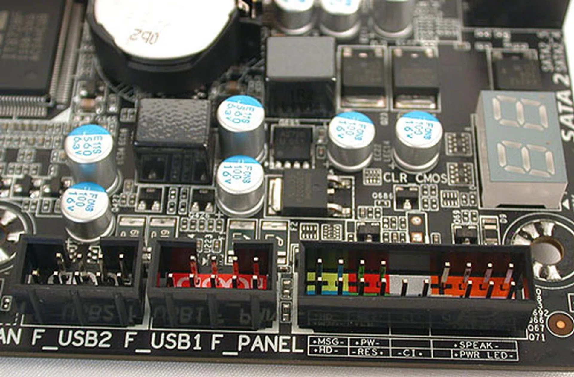 The headers for the front panel are labeled and color-coded to help users. There's also a debugging LED. Again, this configuration is identical to what we saw on Gigabyte's P67 UD7 board. 
