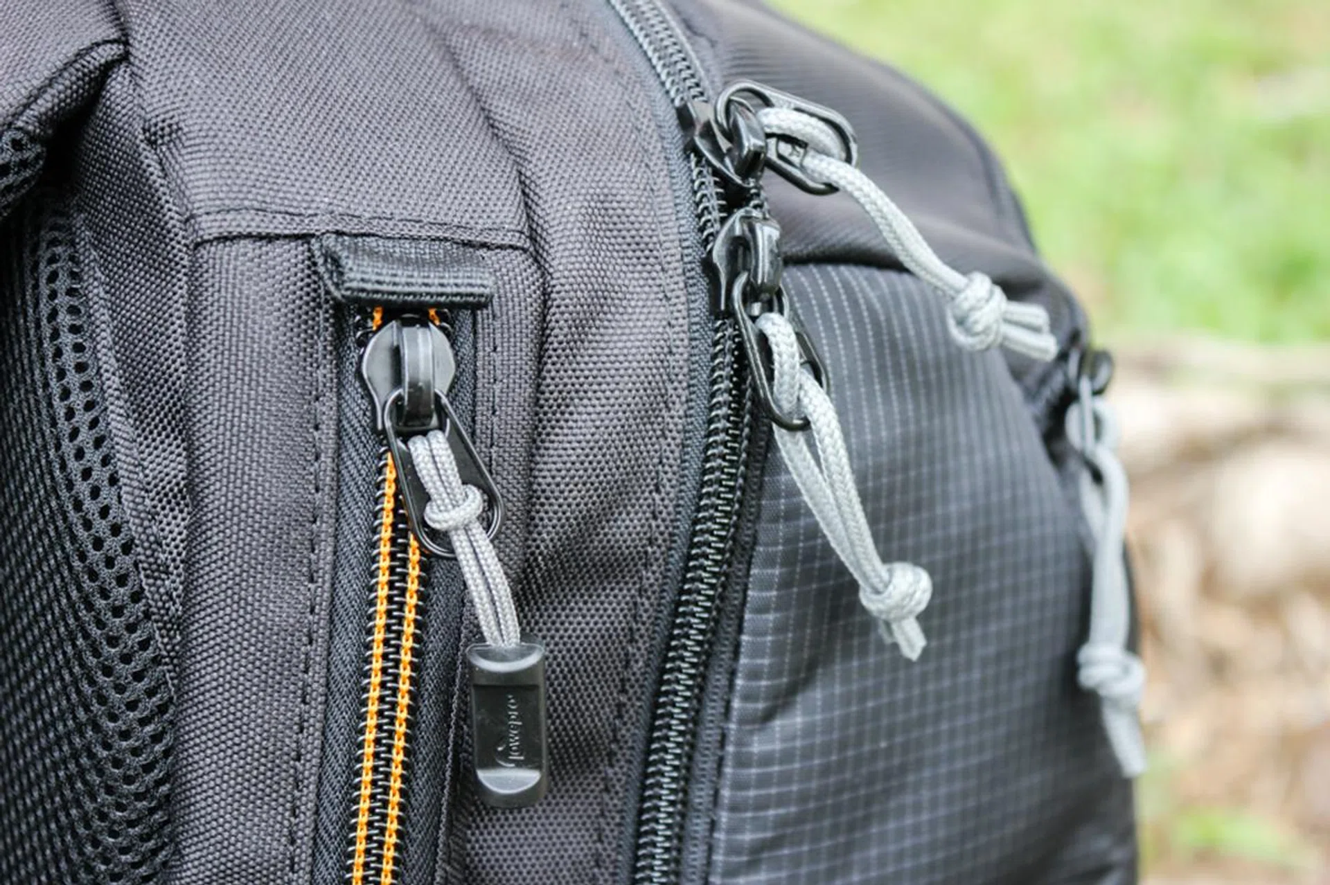 The zips are not water resistant, and rain will likely seep through the cracks in a downpour.