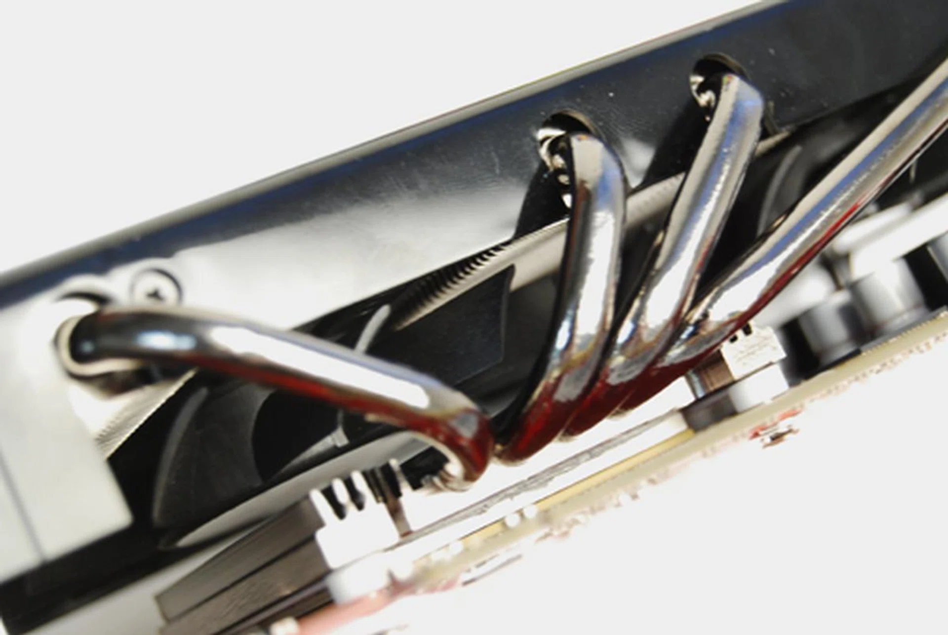 Taking a close peek, one can see the fans hidden underneath the heatsink array.