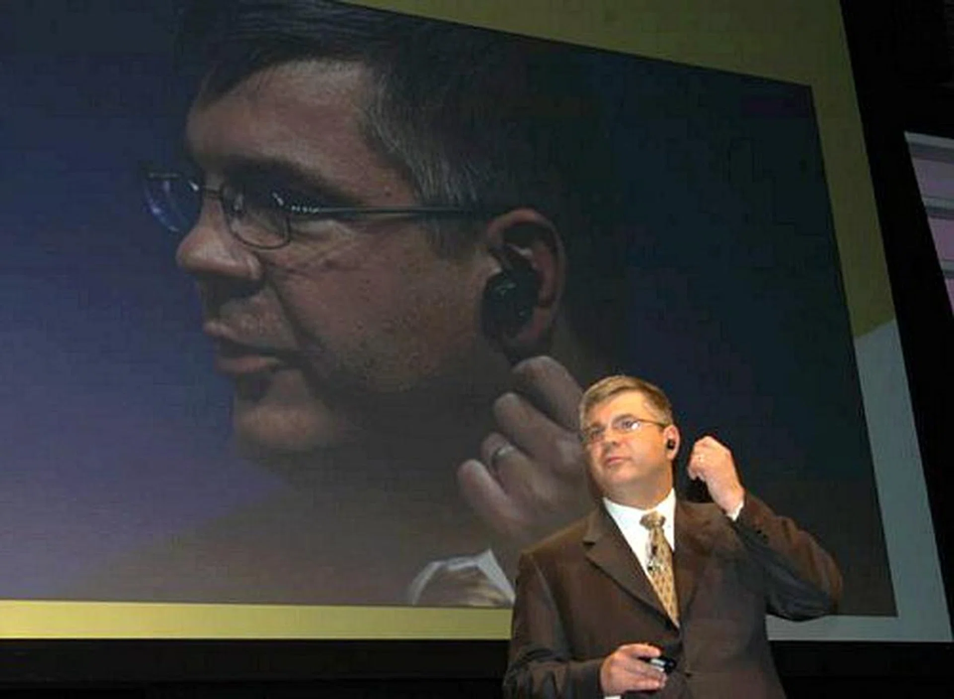 Ron Garriques, president of Motorola's mobile devices business, is seen here wearing the H5 MINIBLUE Bluetooth headset. It's the smallest in existence, and picks up voice through the ear canal.