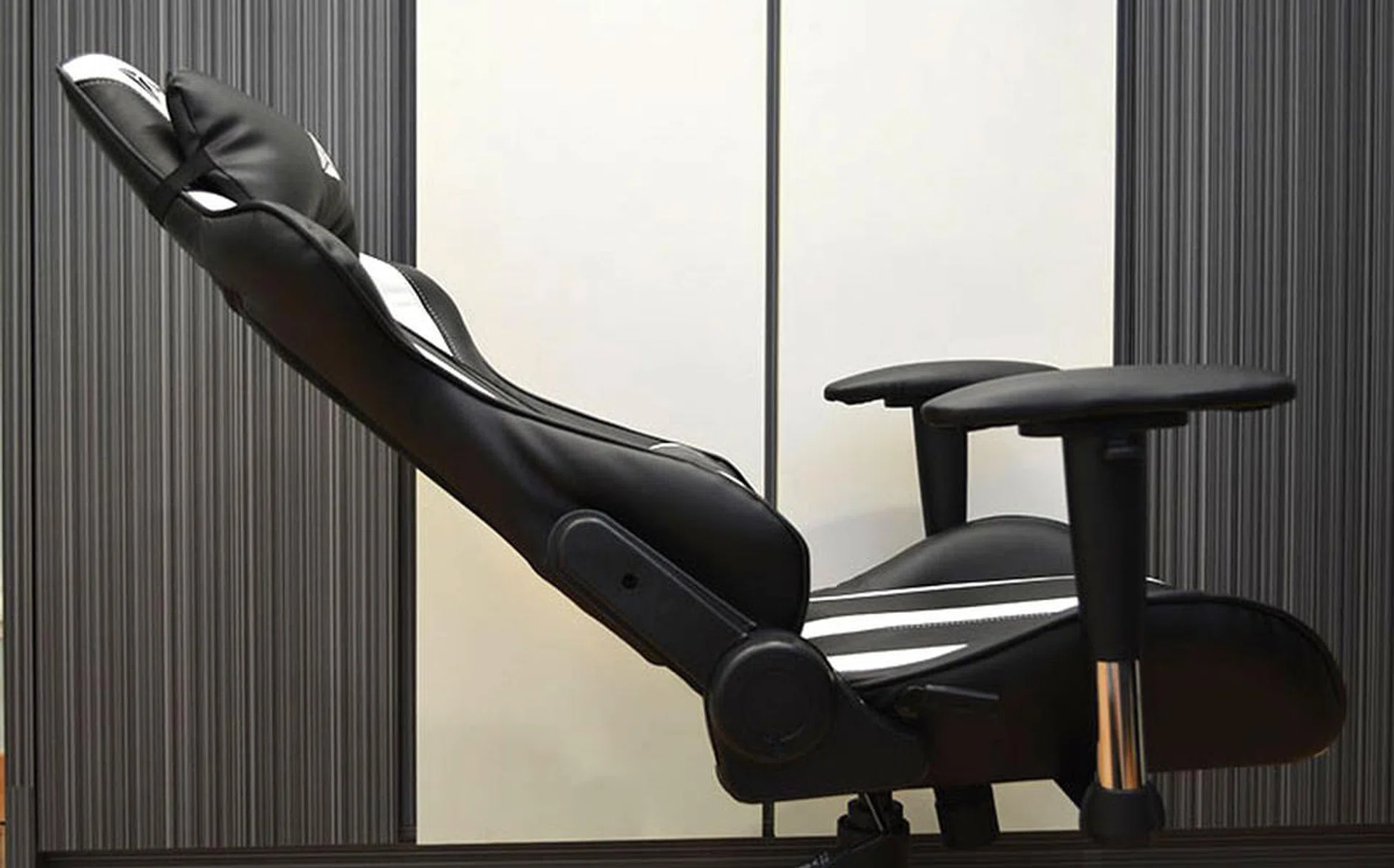 The Throne reclines by about 155° at its lowest.