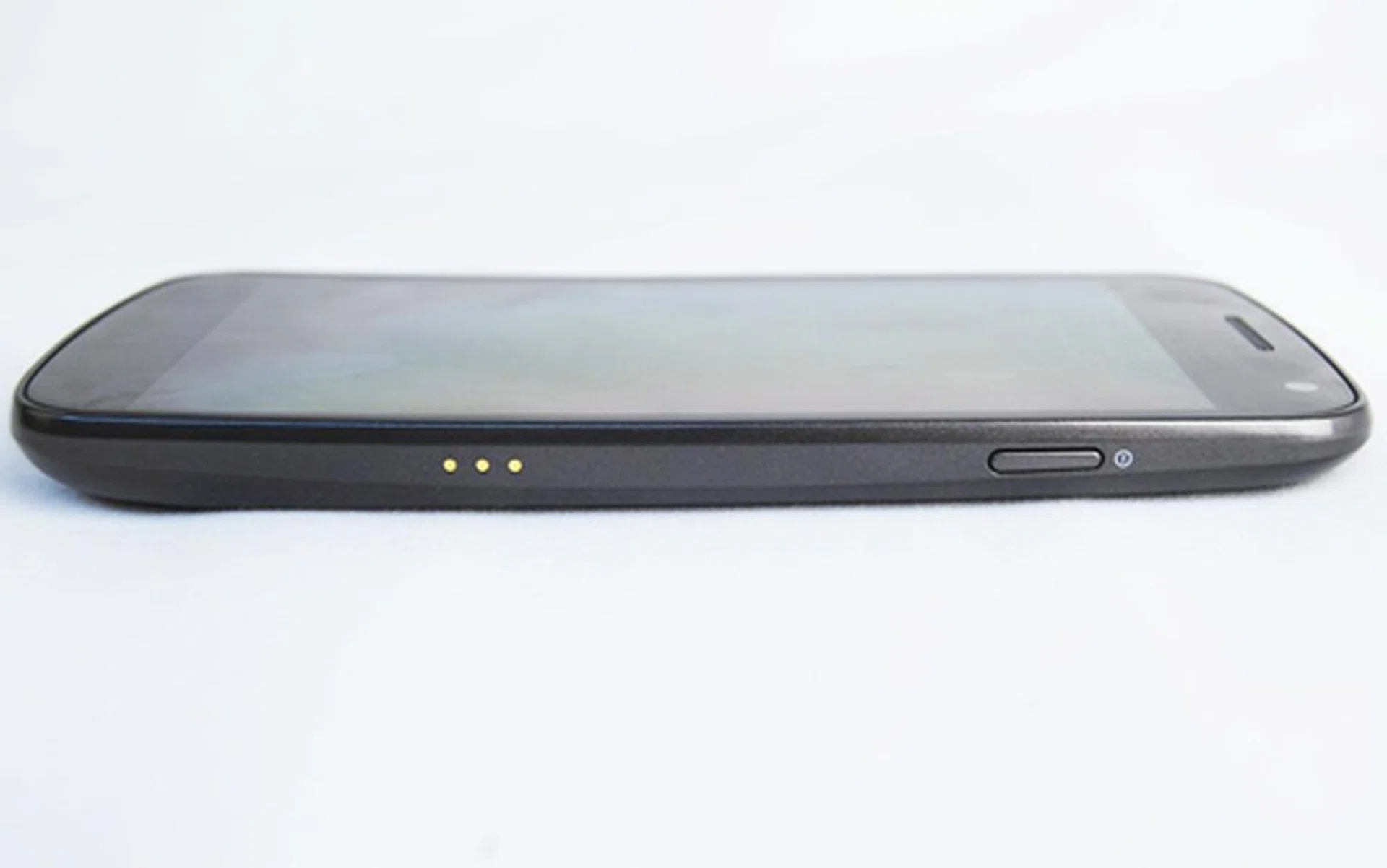 A power button sits on the right side of the phone. Both buttons provide good tactile feedback despite their thinness. There's a 3-pin connector on the right as well for docks and other accessories.