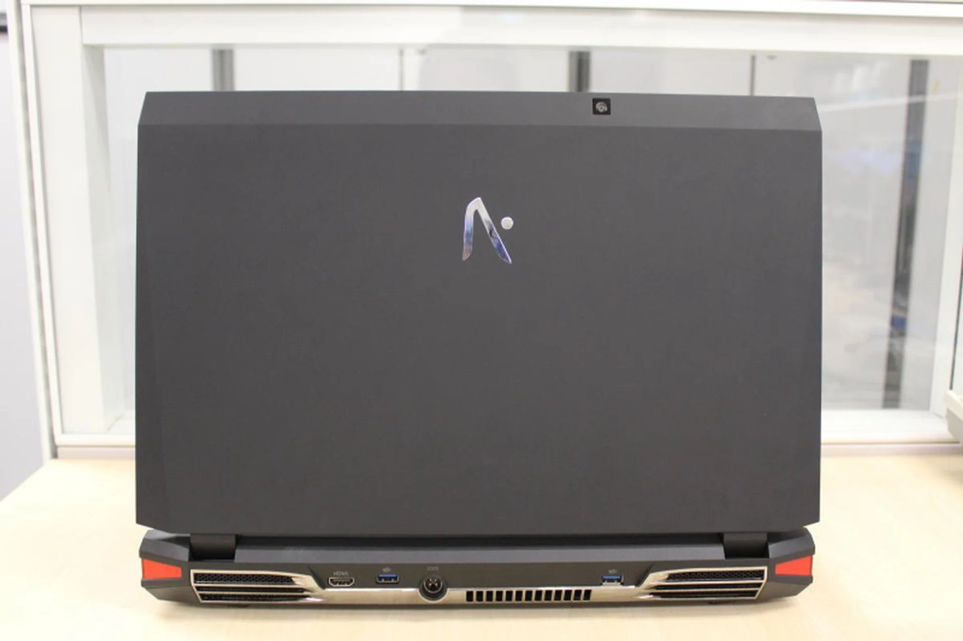The back has accented vents, two more USB 3.0 ports, as well as HDMI and DC input.