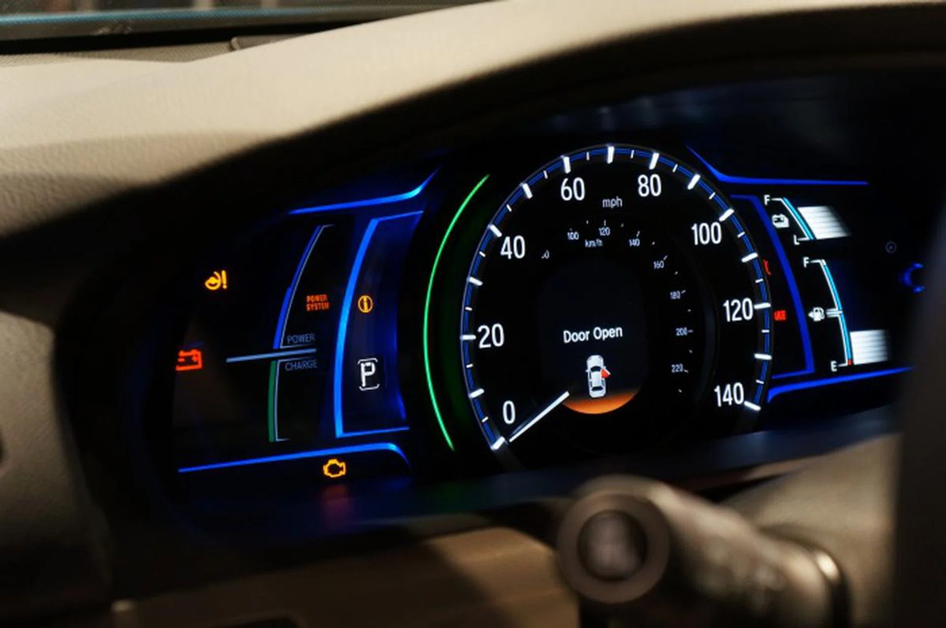 Checking the retrofitted Honda Odyssey's main dashboard, we noticed there's a battery power gauge along with a fuel gauge for conventional drive.