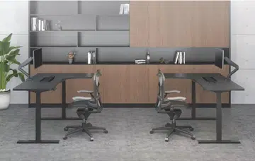 The L-shaped desk can still be raised to be used as a standing desk. Image Source: Tableholic.