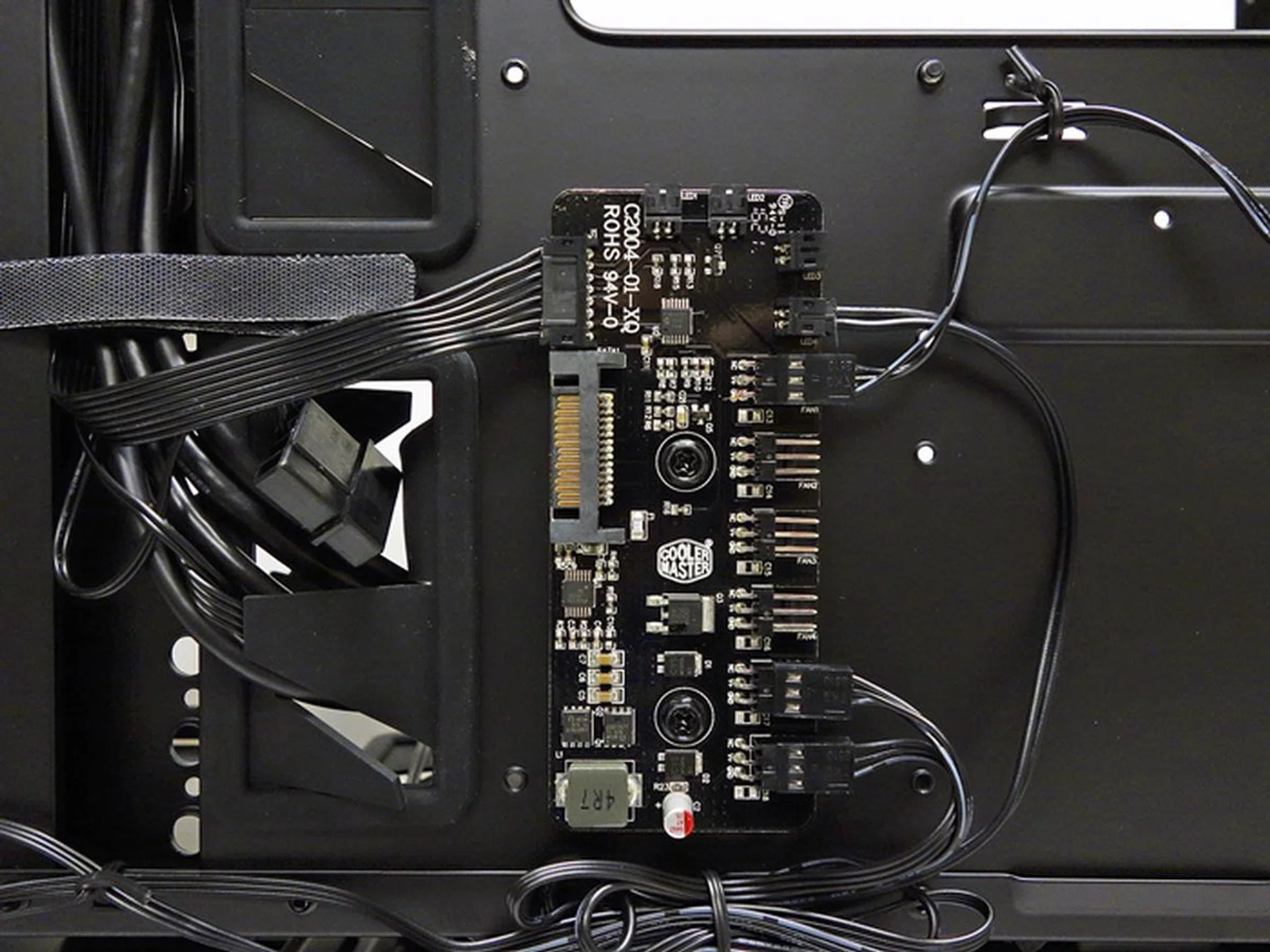 There's a plastic cover that protects the fan and LED controller hub, and we removed it for a clearer shot.