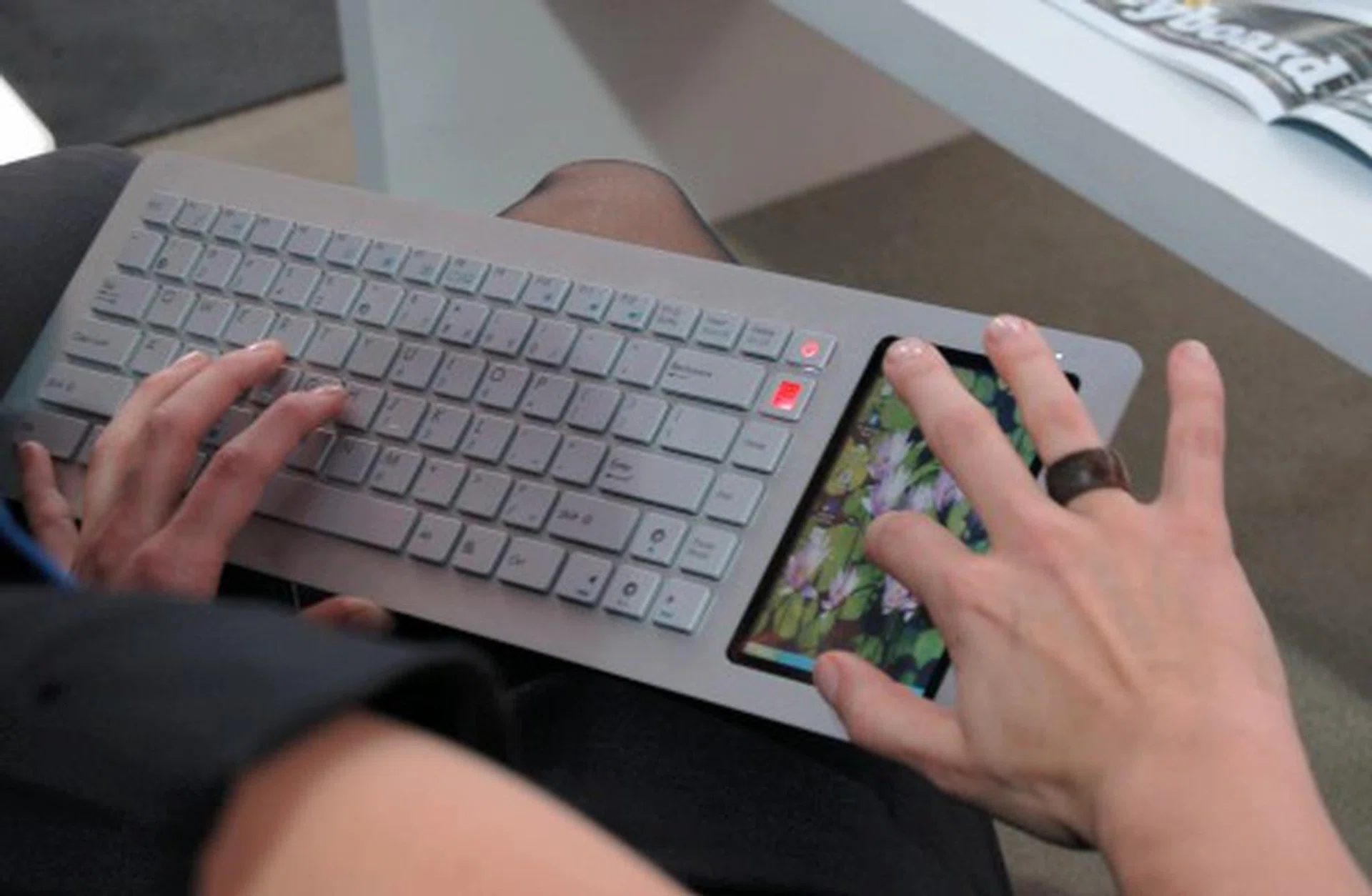  Here's another look at the model manipulating the touch-screen display.  