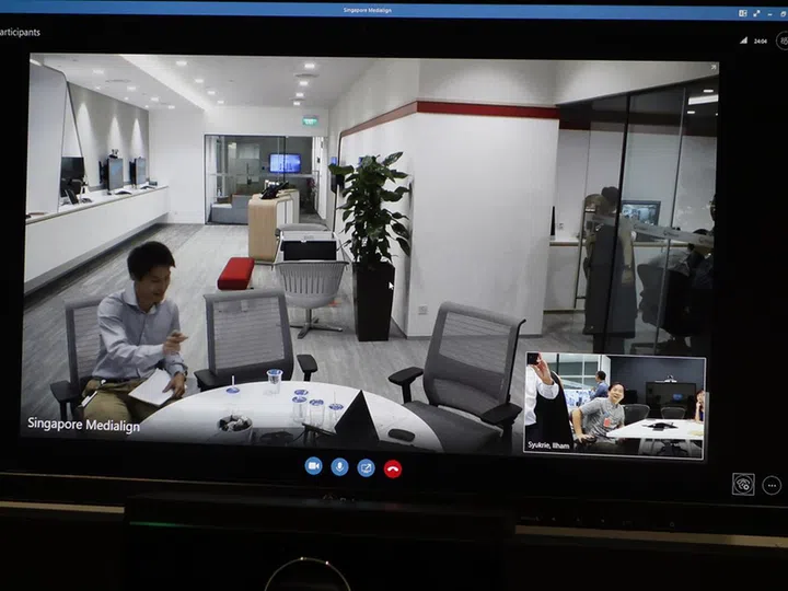 The inset video is due to the automatic group framing feature of Polycom Studio's camera.