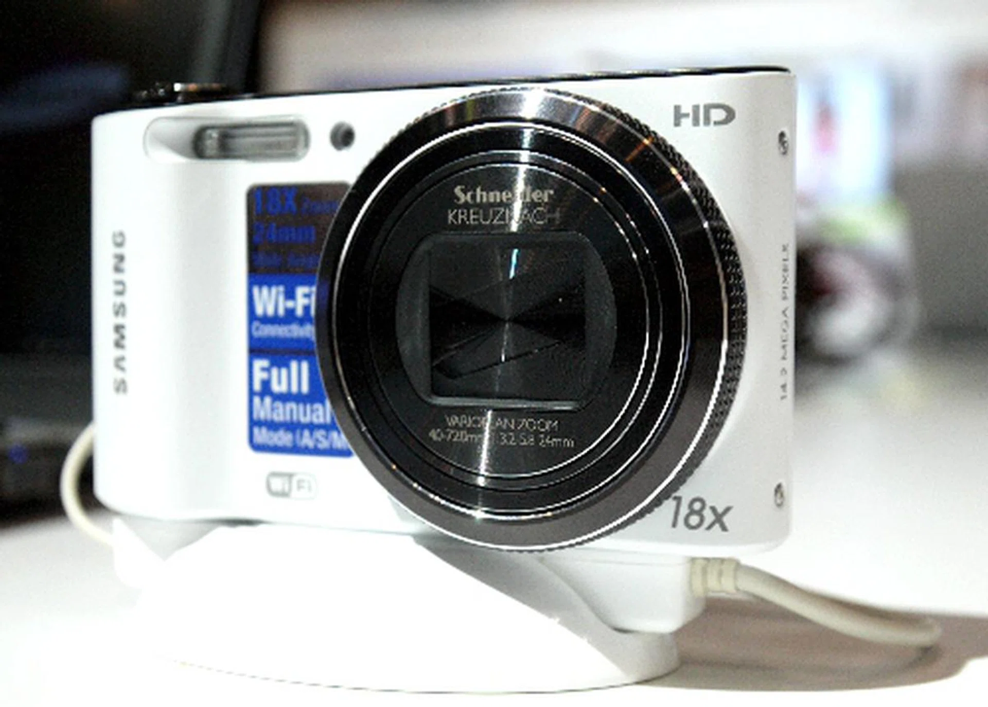 The WB150F features a total pixel count of 16.4-megapixels, and a Schnieder-Kreuznach 4 ~ 72 mm lens with 18X optical zoom. It also does 720/30p movie recording. Priced at $399, the WB150F will be available from March 2012.  