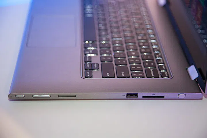 On the right side of the Inspiron 13 7000 laptop, you'll find (from left to right) the power button, volume buttons, USB 2.0 port, an SD/MMC media reader and the stylus.