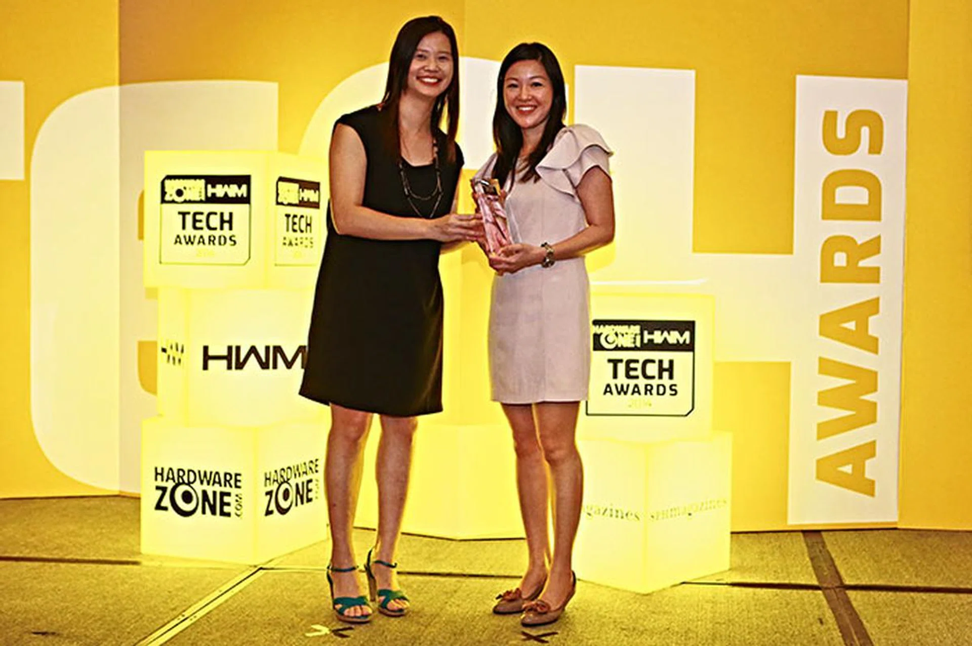 Logitech won the Readers' Choice awards for Best Keyboard Brand and Best Mouse Brand. Here's a smiling Ms. Shirley Neo, Logitech's Country Manager for Singapore, receiving the trophy.