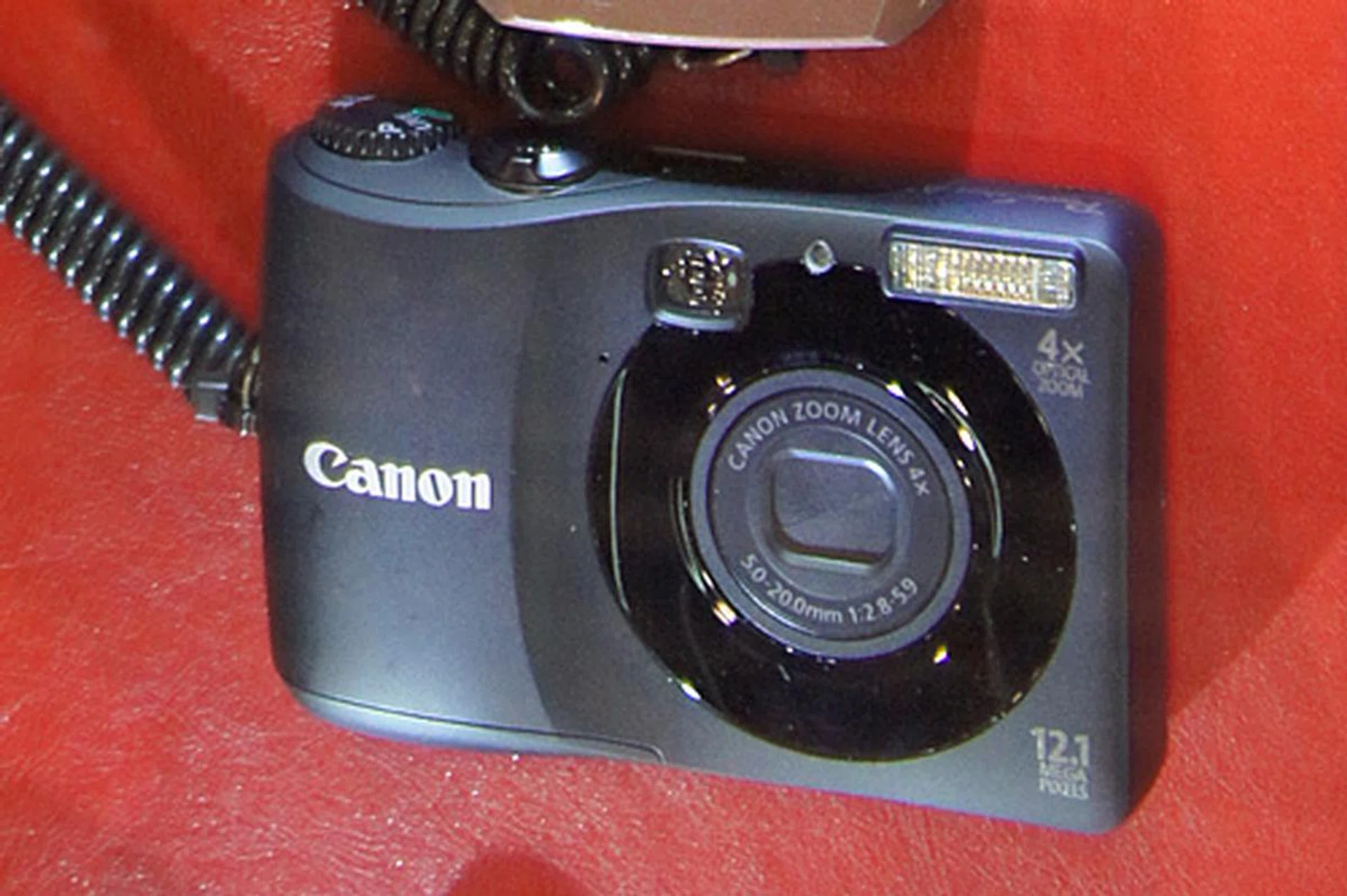 The 12.1-megapixel PowerShot A1200 comes with a 28mm lens with 4x optical zoom, a 2.7-inch LCD, a Smart Auto mode, a Blur Reduction mode, and a Discreet mode. It also does 1280 x 720 HD movie recording. It has an optical viewfinder and is powered by AA batteries. It's going for $169, and freebies include two 4GB SD cards and an AA rechargeable battery kit.