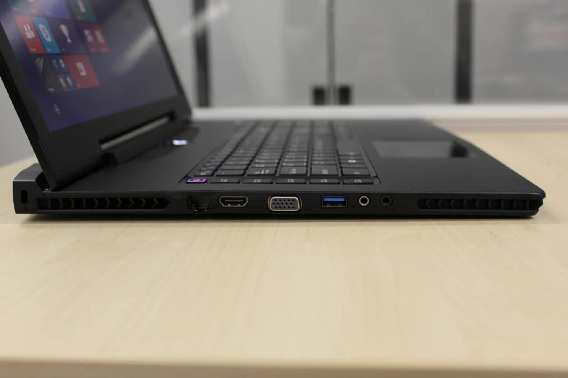 The left side of machine holds the ports for the Ethernet, D-Sub VGA, HDMI and audio input/output.