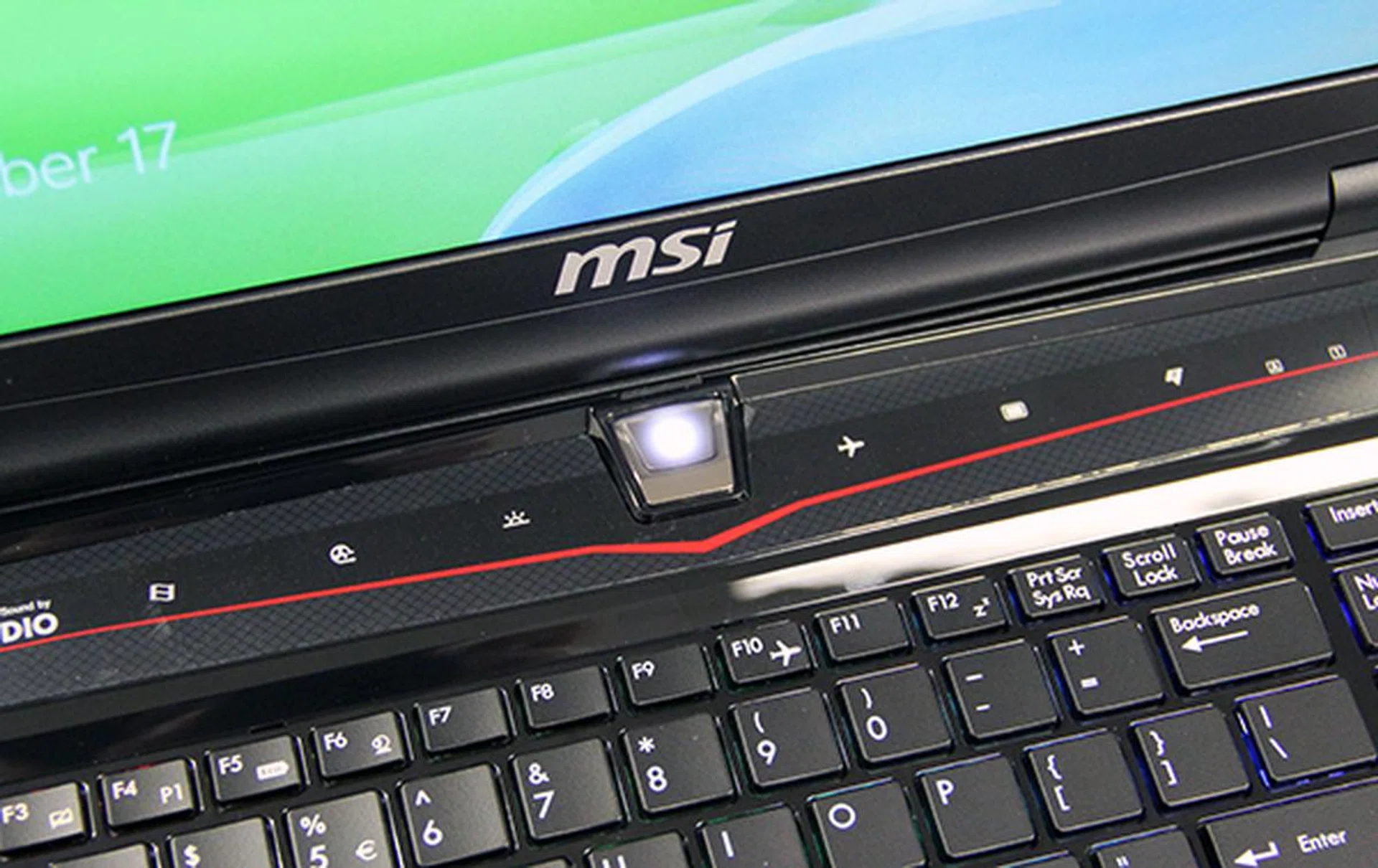Above the keyboard are these touch-sensitive buttons which enables functions like airplane mode.