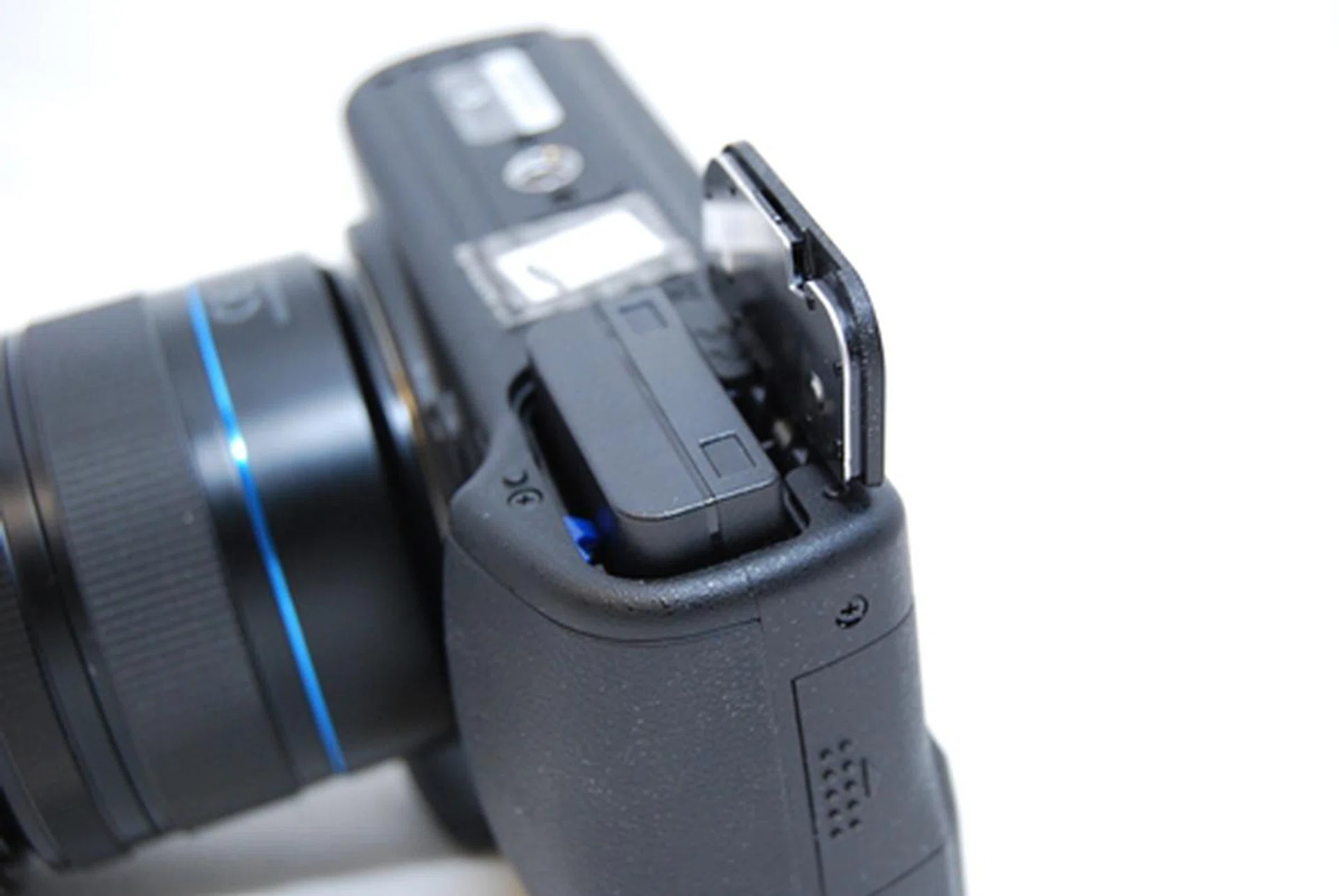The battery compartment is located at the bottom with a safety lock to push before you can actually open it. 