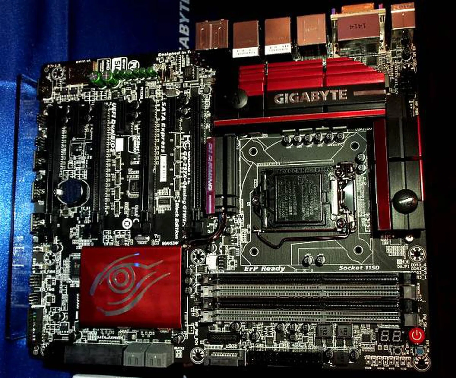 G1 Gaming boards now have a new Red/Black livery. Notice the green Nichicon audio caps to the top left and the water block heatsinks around the MOSFETs.