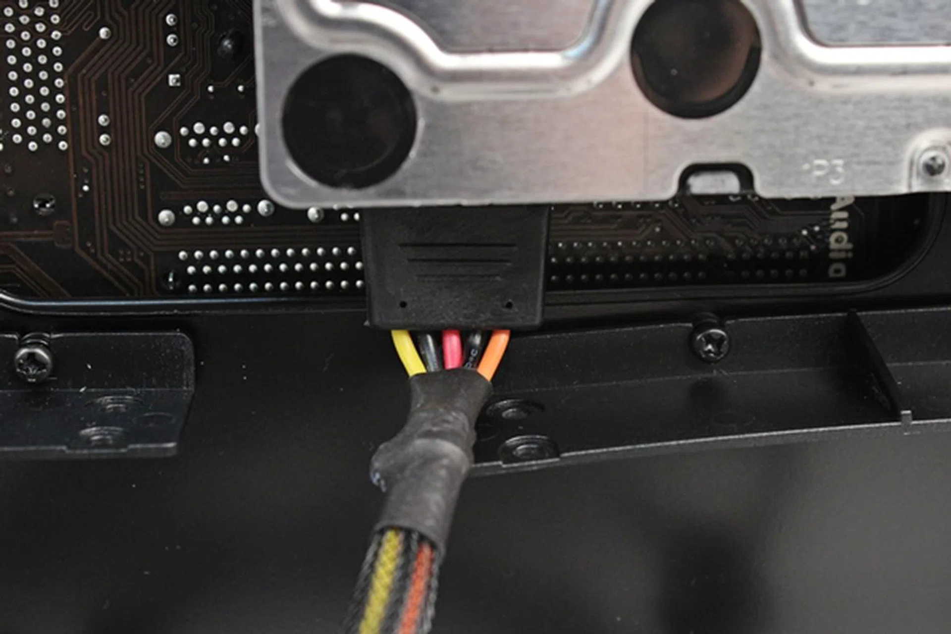 The SATA power connector was pushing against the plastic mounting bracket of the 2.5-inch drive below.