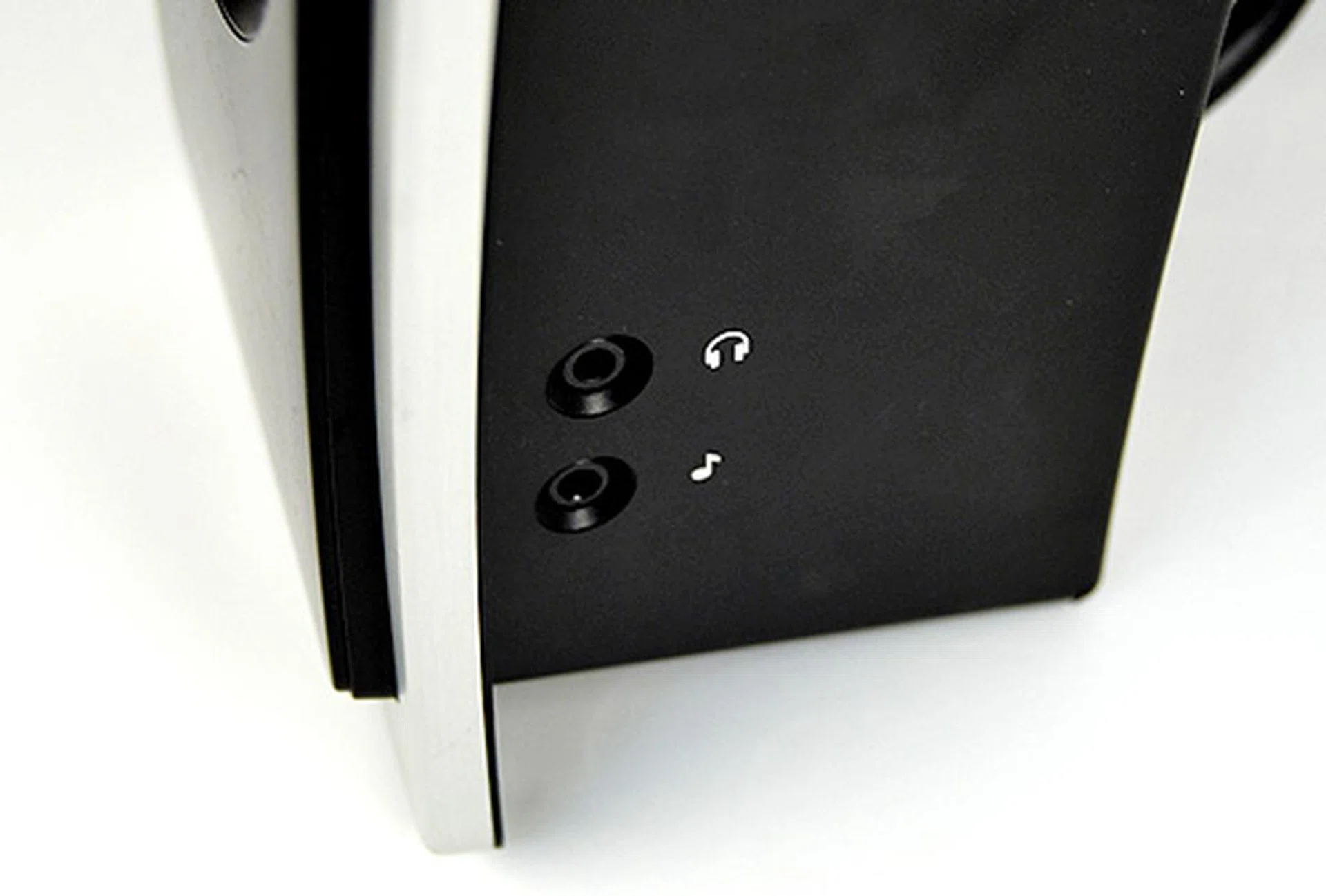 The Z-Cinema doesn't come with a wired remote control hub like the other systems do. However, there are 3.5mm stereo jacks for headphones and aux outputs at the side of the right speaker.