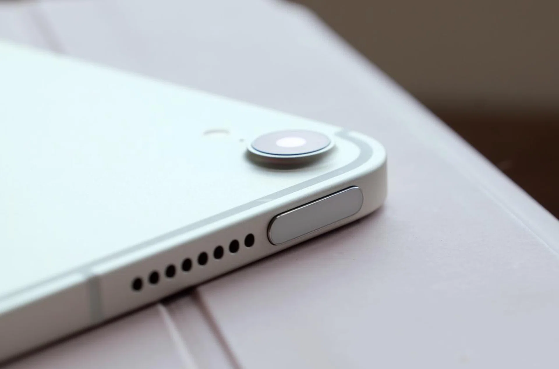 The Touch ID sensor has been integrated into the top button.