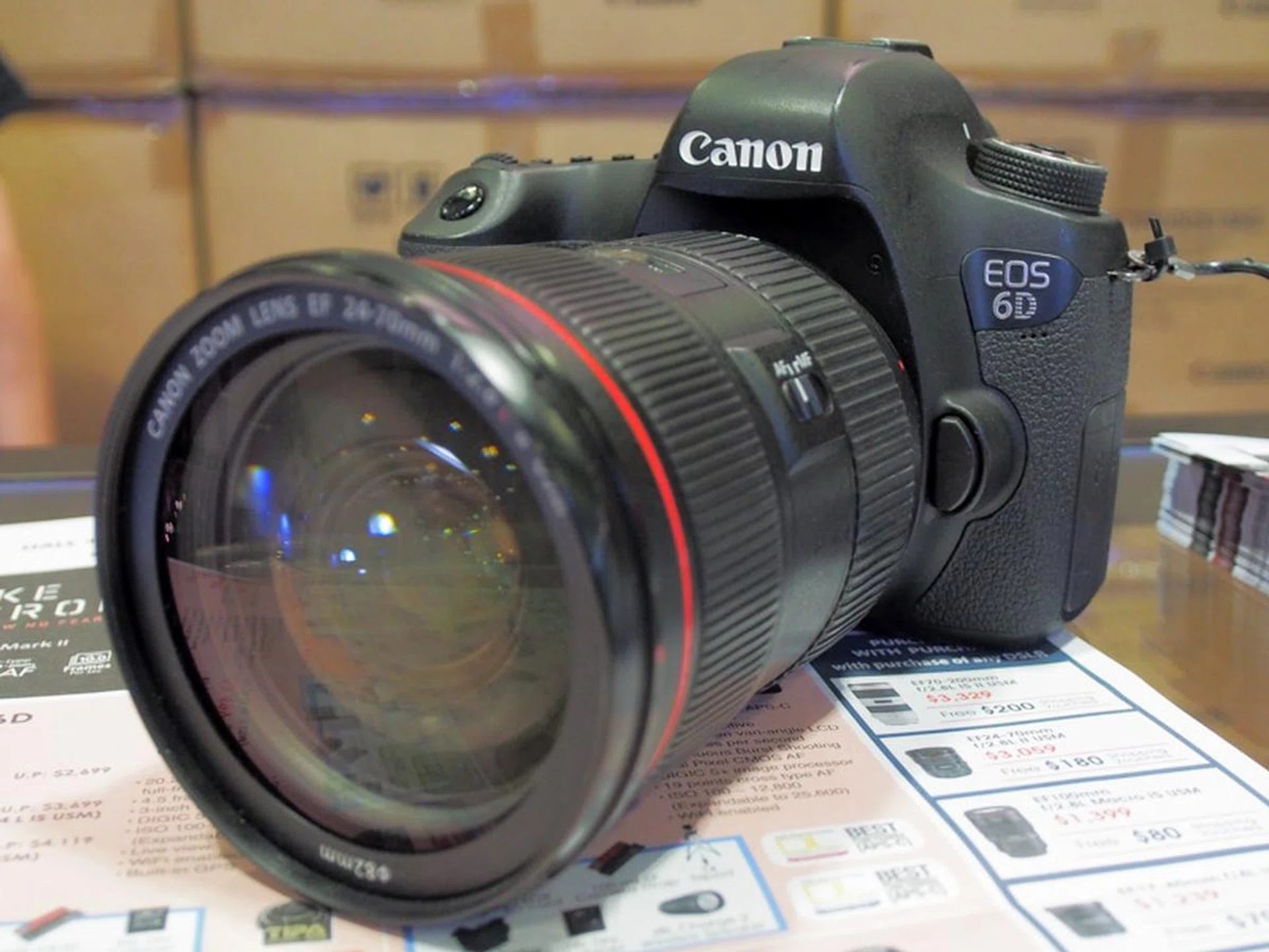 The EOS 6D is a 20.2 megapixel camera that goes up to ISO 102,400, with Wi-Fi, and built-in GPS. You can get this with the EF 24-70 f4 L IS USM lens for $3,499, and it comes with two 32GB SD cards, an EOS 6D guidebook, a 100mil EF camera strap,a 36L dry cabinet,a JBL Charge 2 wireless speaker, a $80 shopping voucher, and a PowerShot N100.