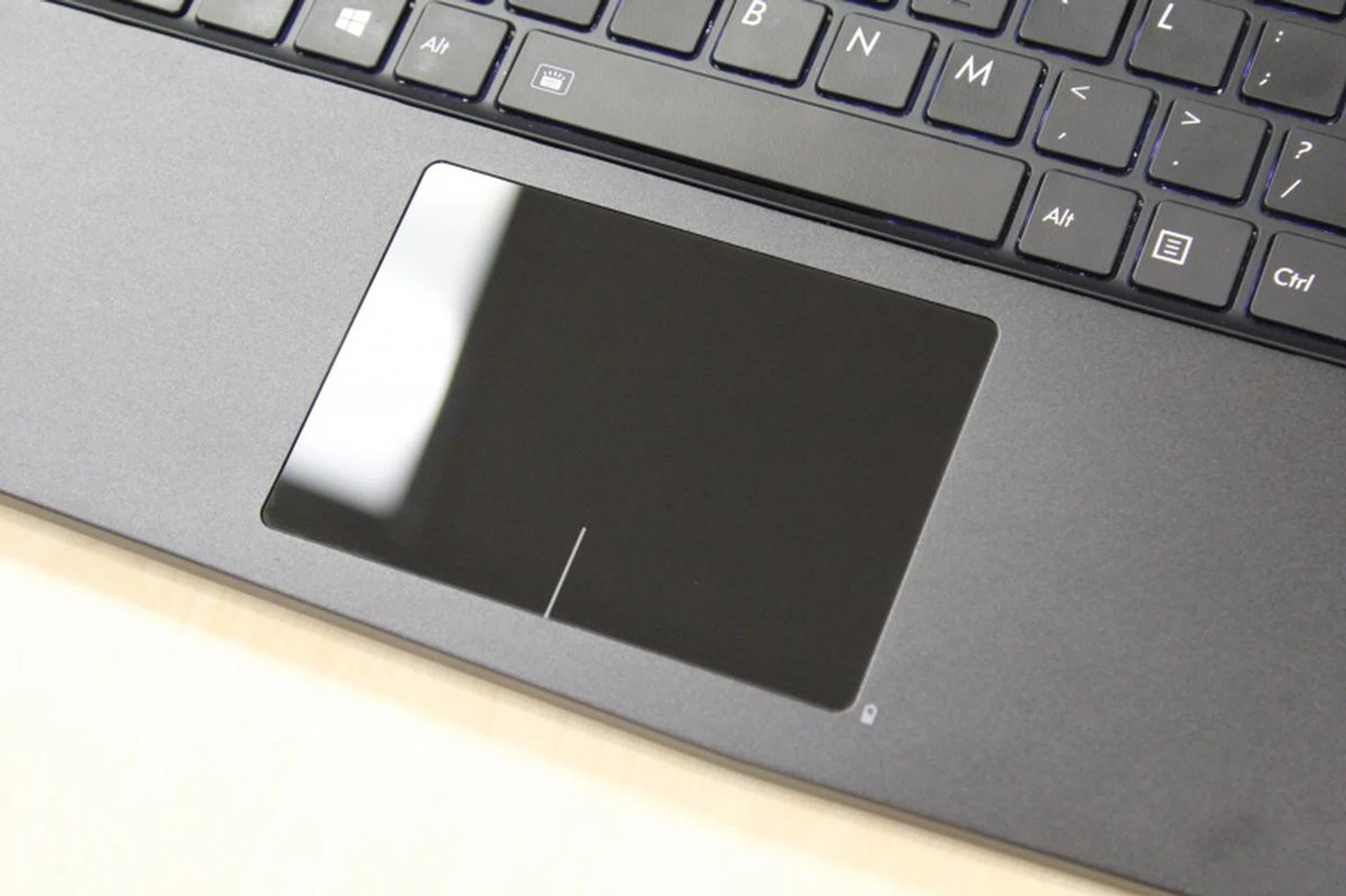 The trackpad is nice and shiny, and your fingers can slide on it easily.