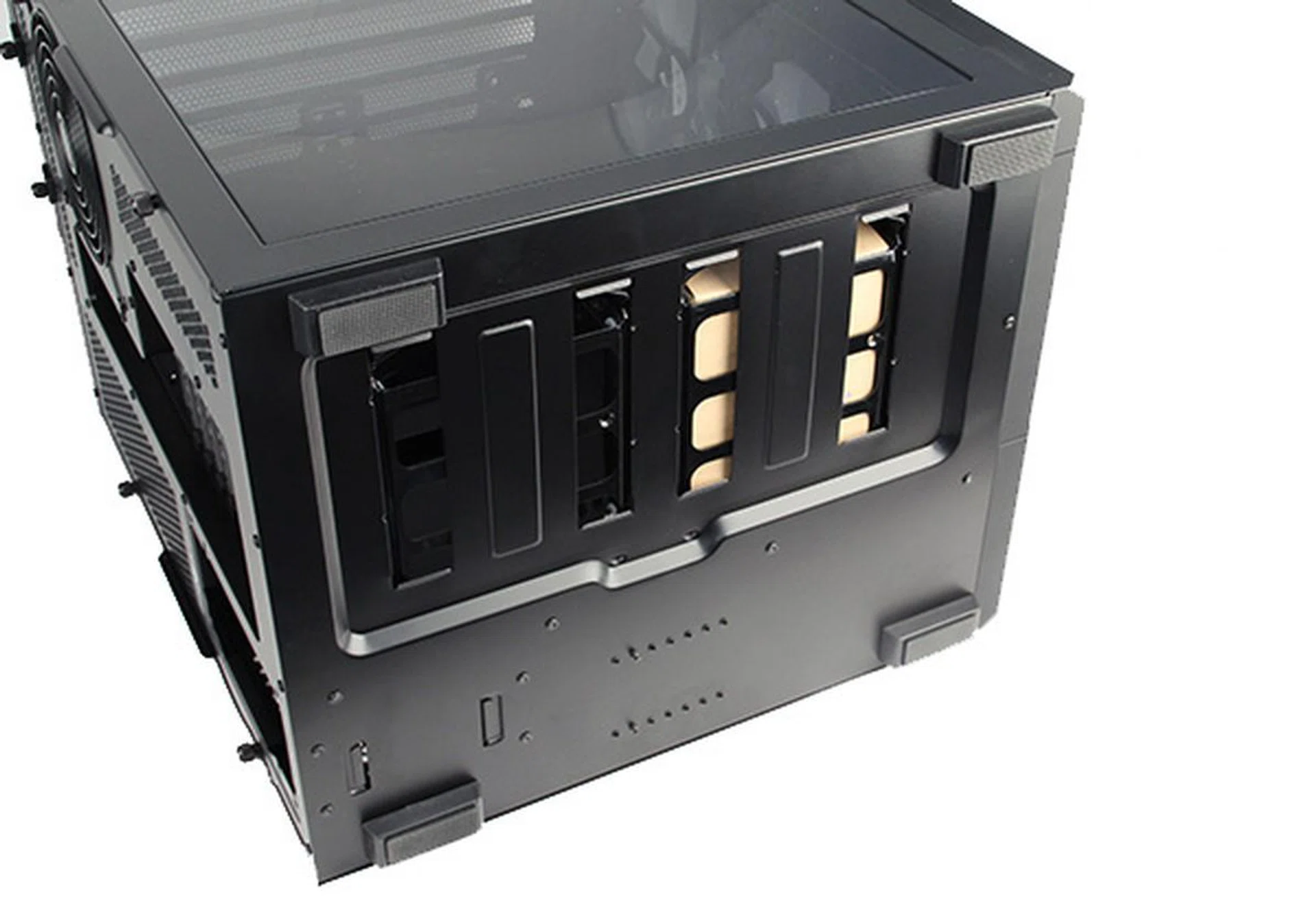 There are rubber feet at the bottom and the cut-outs that you see are for the two 3.5-inch drive trays.