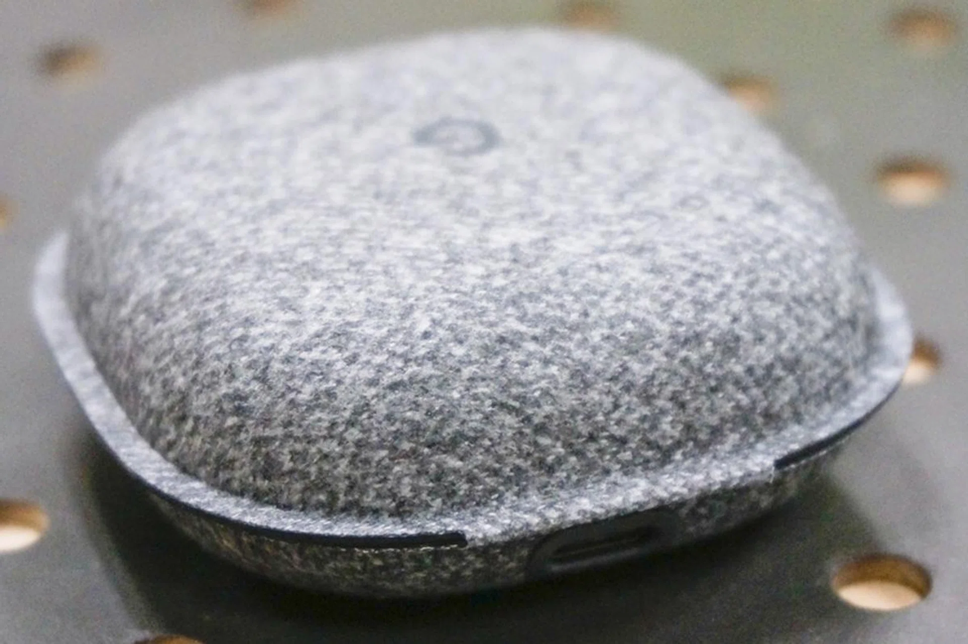 the micro-USB port at the bottom of the case charges both case and headphone.