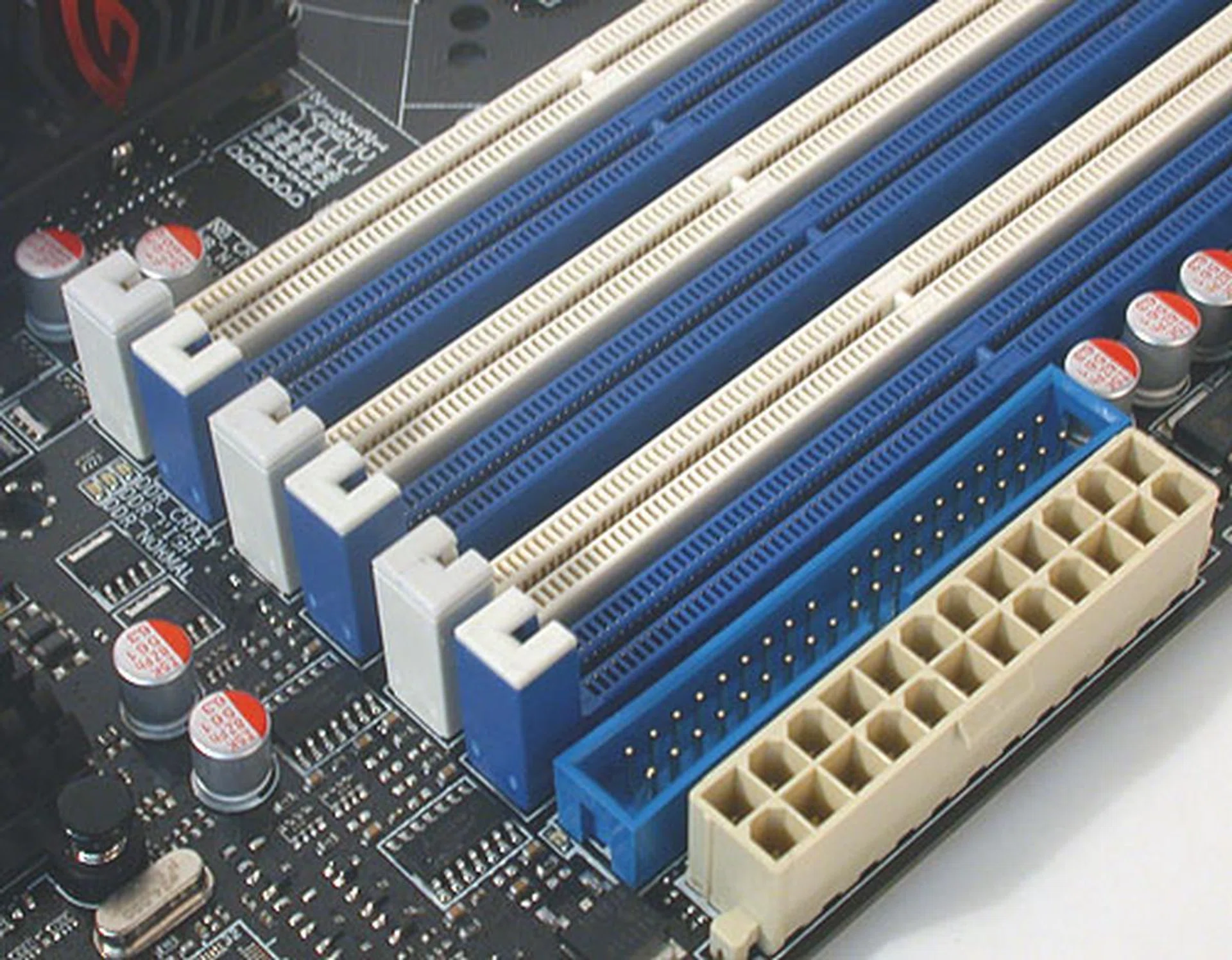 The DIMM slots on the Gene only have the usual latches on one end. The other end, shown here has no latches, making it easier to remove in a space constrained environment like a microATX board. Notice too how close the IDE and power connectors are placed.