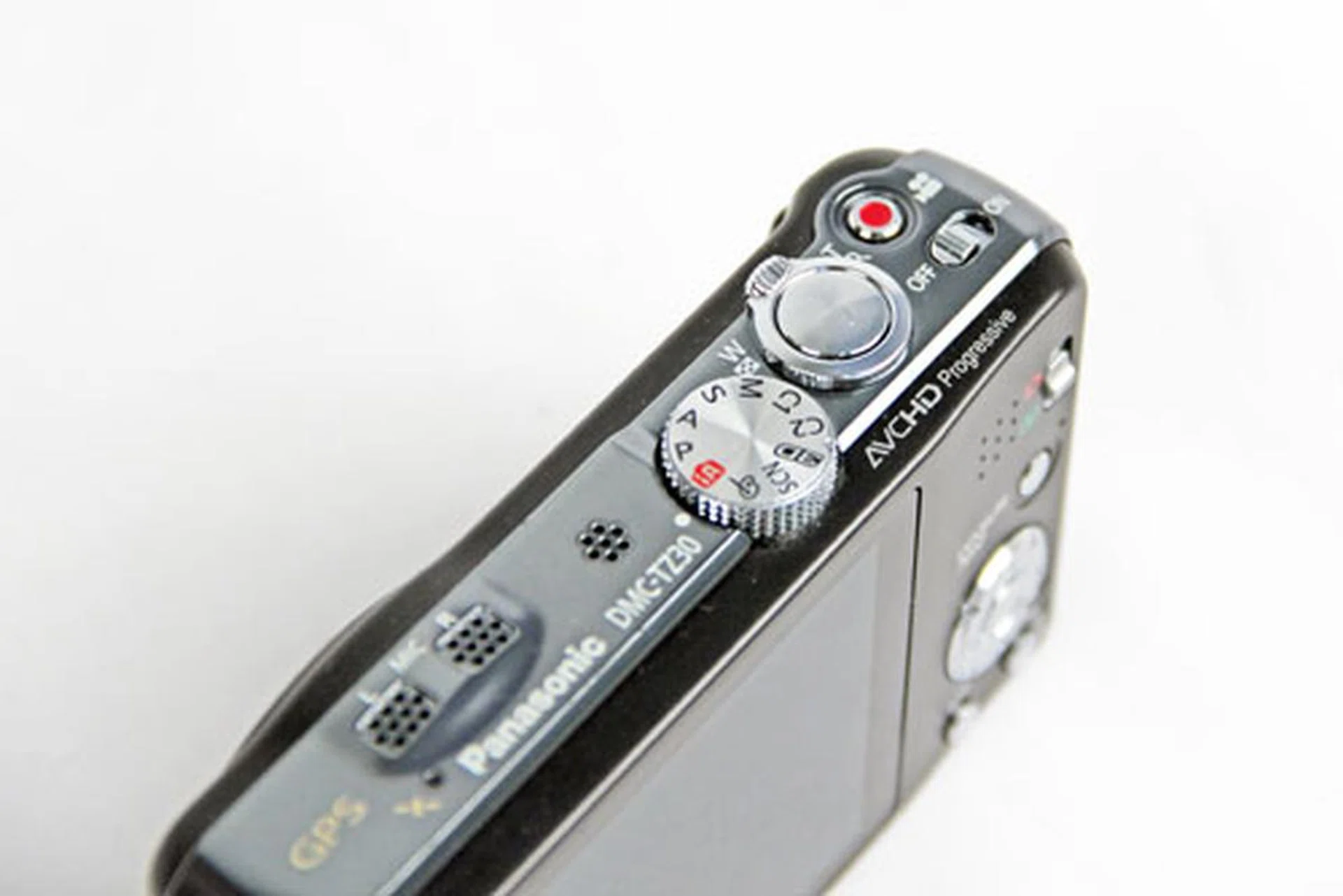 The mode dial is small, and its off-center placement makes it awkward to reach and use when shooting.