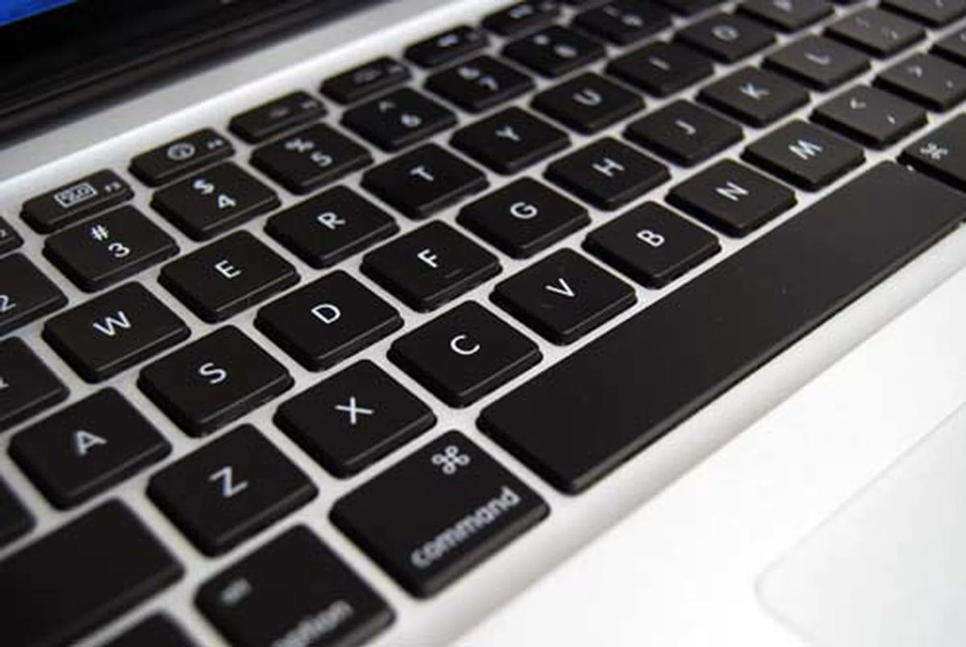 Lifting the lid, the interior will be familiar to you if you've seen the unibody MacBook Pro before. The keys are backlit, and are great for working in dark places (such as your secret basement lair).