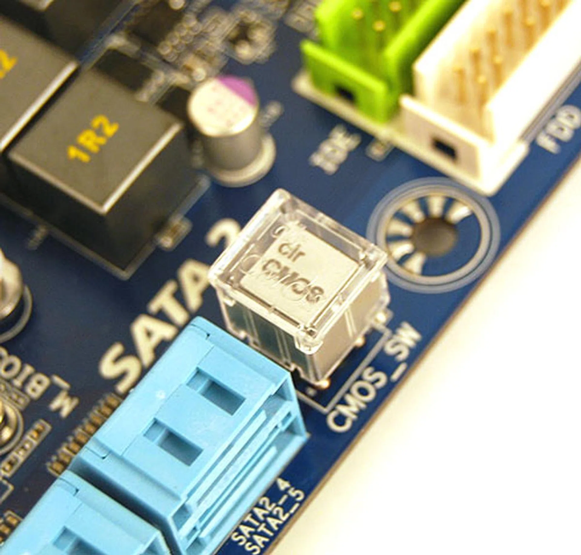 Perhaps Gigabyte heard the feedback of enthusiasts about the 'danger' of having a Clear CMOS button readily available because this button here has a plastic cap over it to prevent accidents.