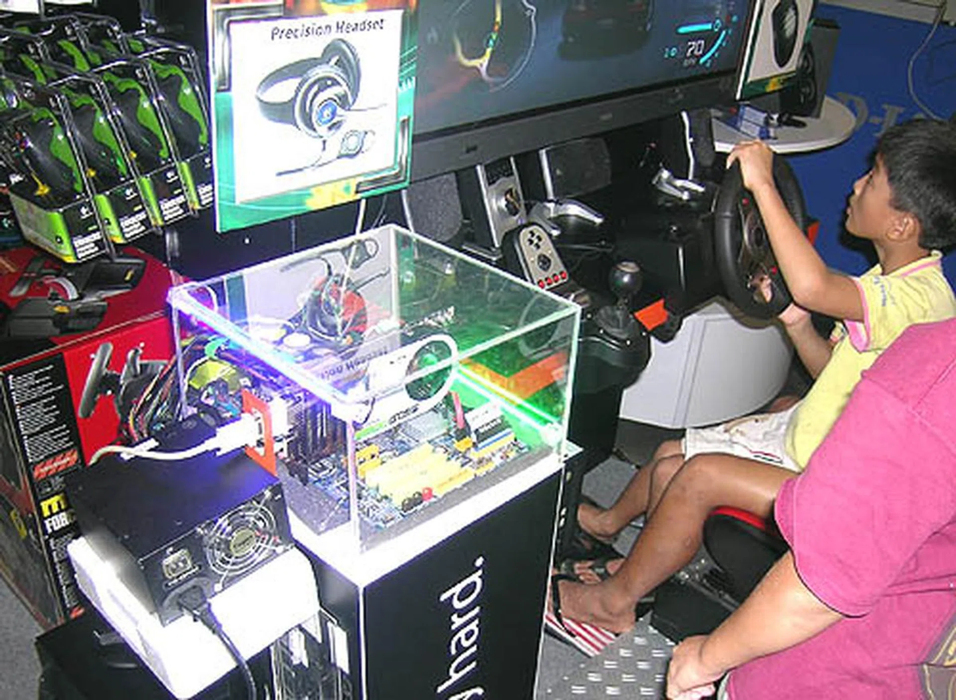 A demo system featuring many of the products brought in by Kaira. This includes the Logitech gaming wheel, the custom system with a XFX GeForce 8800 GTS and a Biostar nForce 680i SLI motherboard. All of which can be bought at the Kaira booth, though prices for the Biostar and XFX GeForce 8800 GTS were unavailable just then.