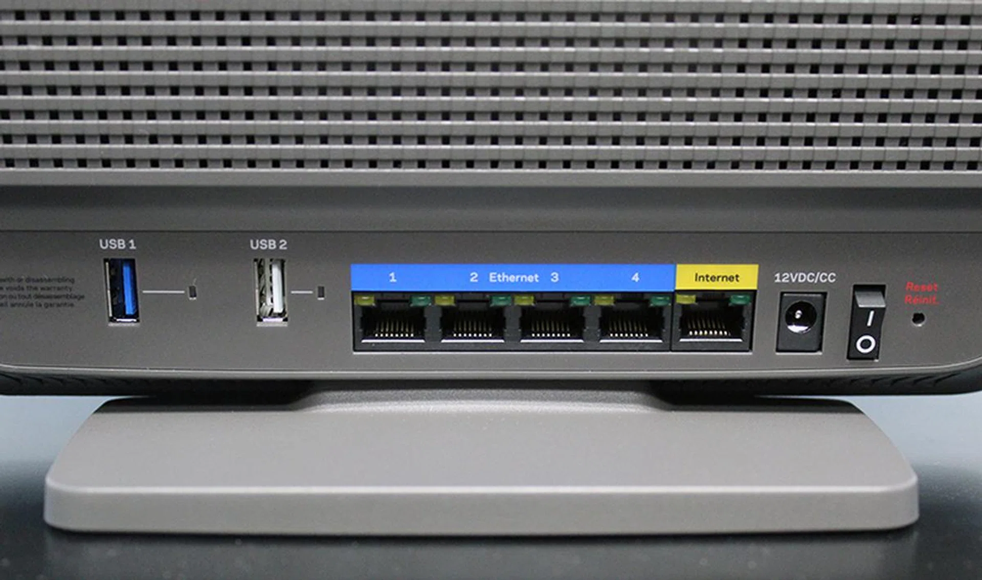 Users can find the usual assortments of ports behind the router. We liked that the two USB ports are spaced wide apart, which makes it easier to connect (and disconnect) devices. Note also the LED indicators on the Gigabit and USB ports.