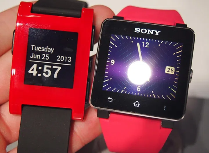 Seen here are the red Pebble watch (left) and the Sony SmartWatch 2 (right).
