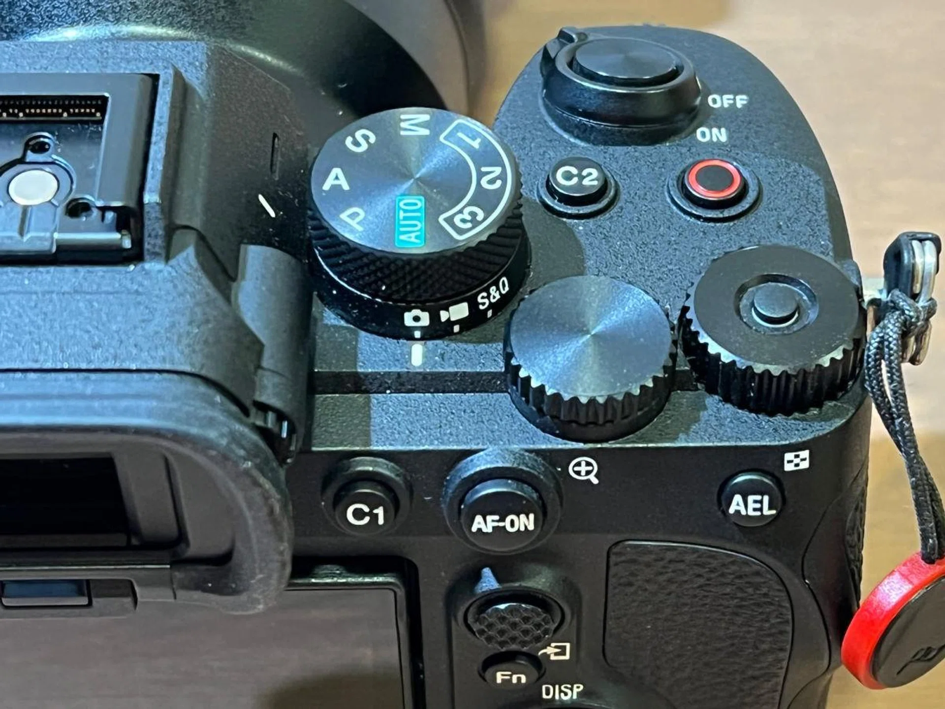 Most of the dials and buttons are located on the top right of the camera.