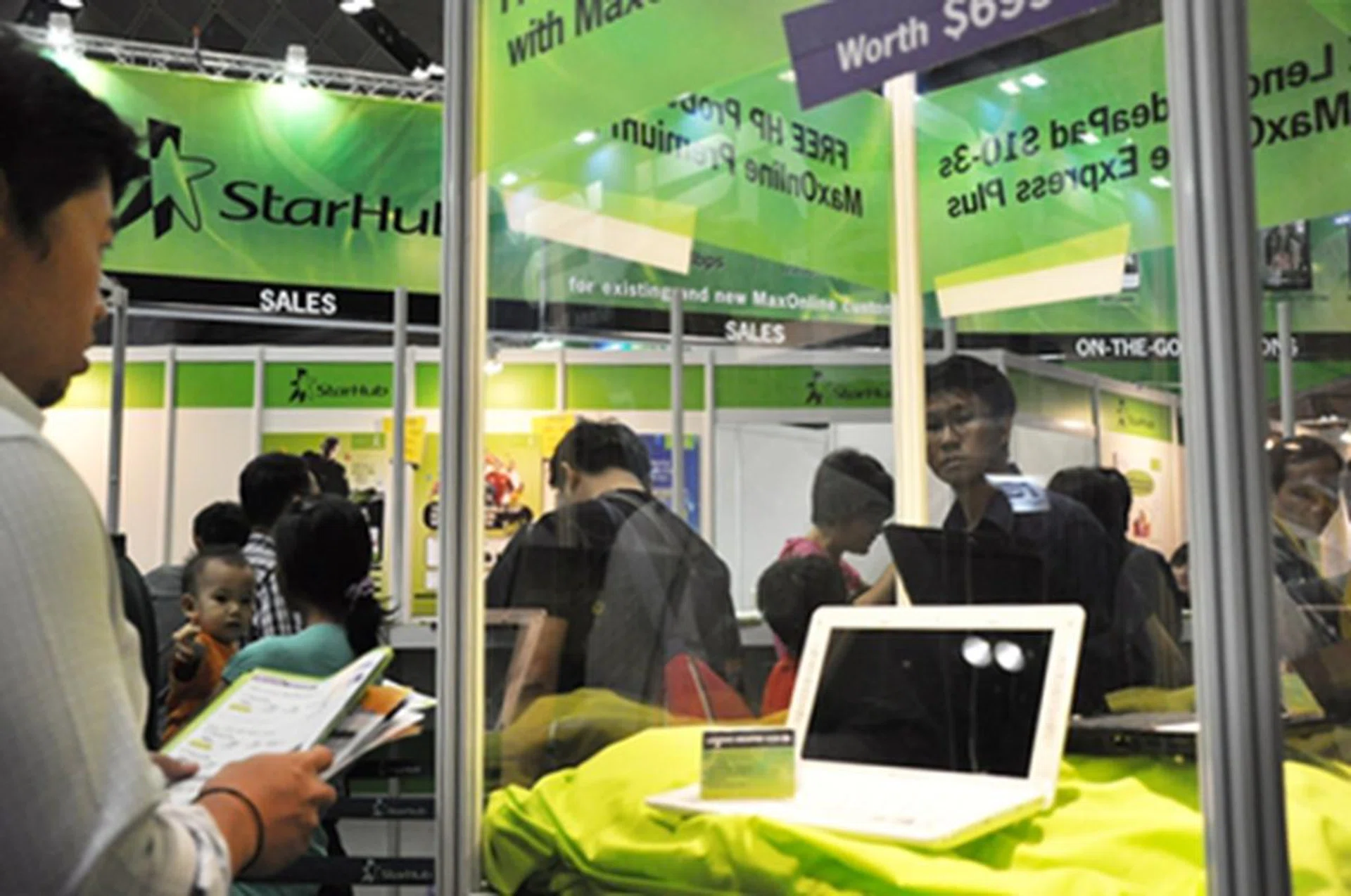 There was a lot of traffic around the Lenovo IdeaPad S10-3s display set, as customers look on in contemplation.