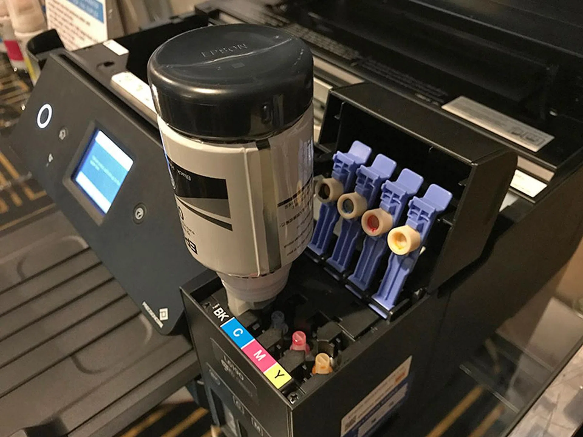 The ink only flows when the correct bottle is inserted into the correct ink tank - so no spills!
