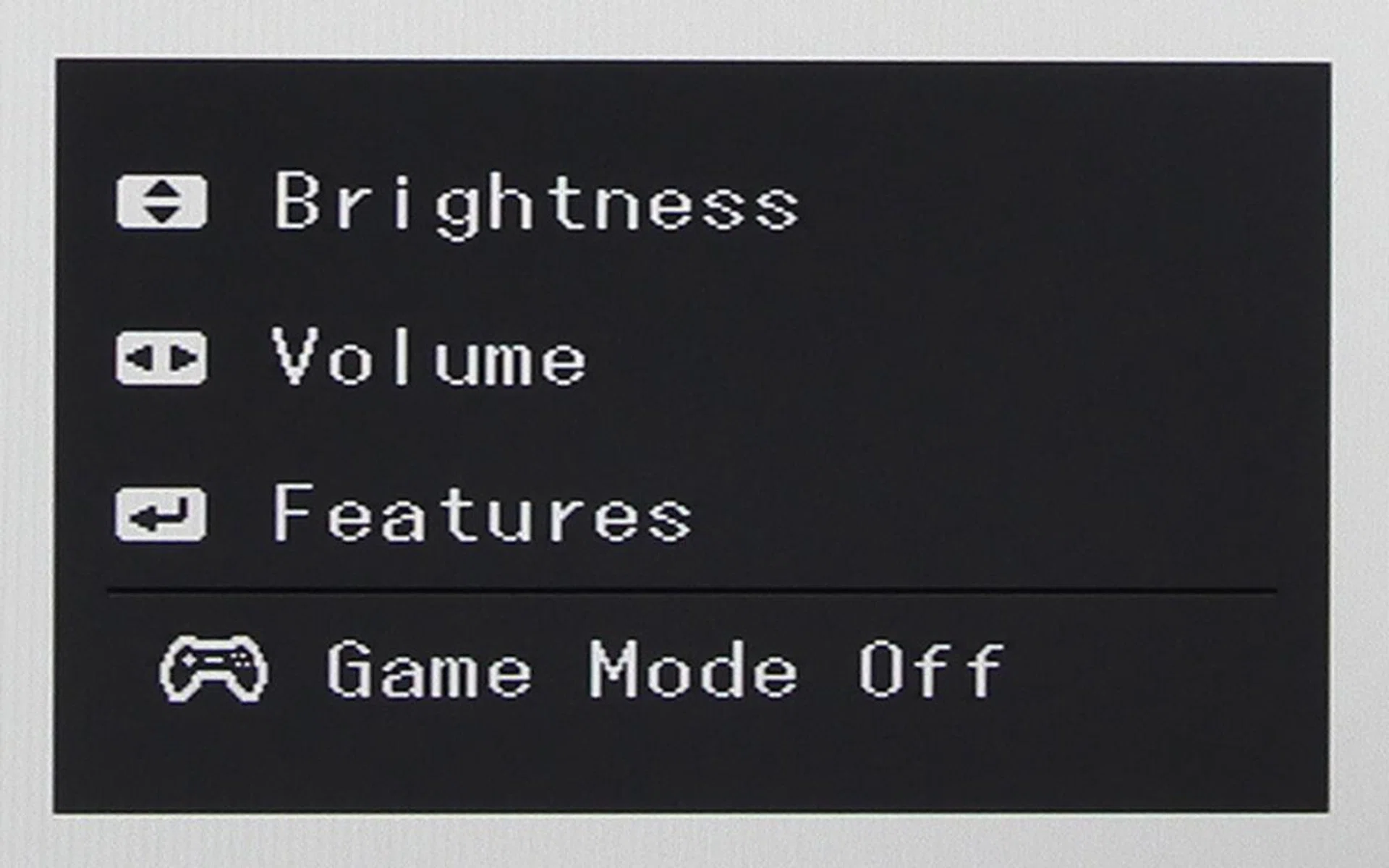 Pressing any of the directional buttons instead of the center button will land you on this menu. From here, you can quickly jump to the brightness/contrast/sharpness or volume sliders.