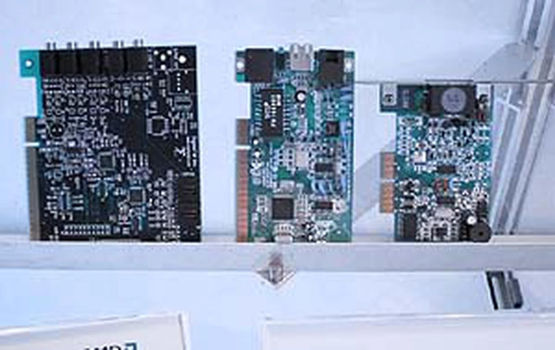 Some cards already developed for the ACR. On the left is Sigmatel's 6 channel
audio card for the PCR slot. The card in the center is a 3-in-1 solution for
home phoneline networking, v.90 analog modem, and an additional USB port.